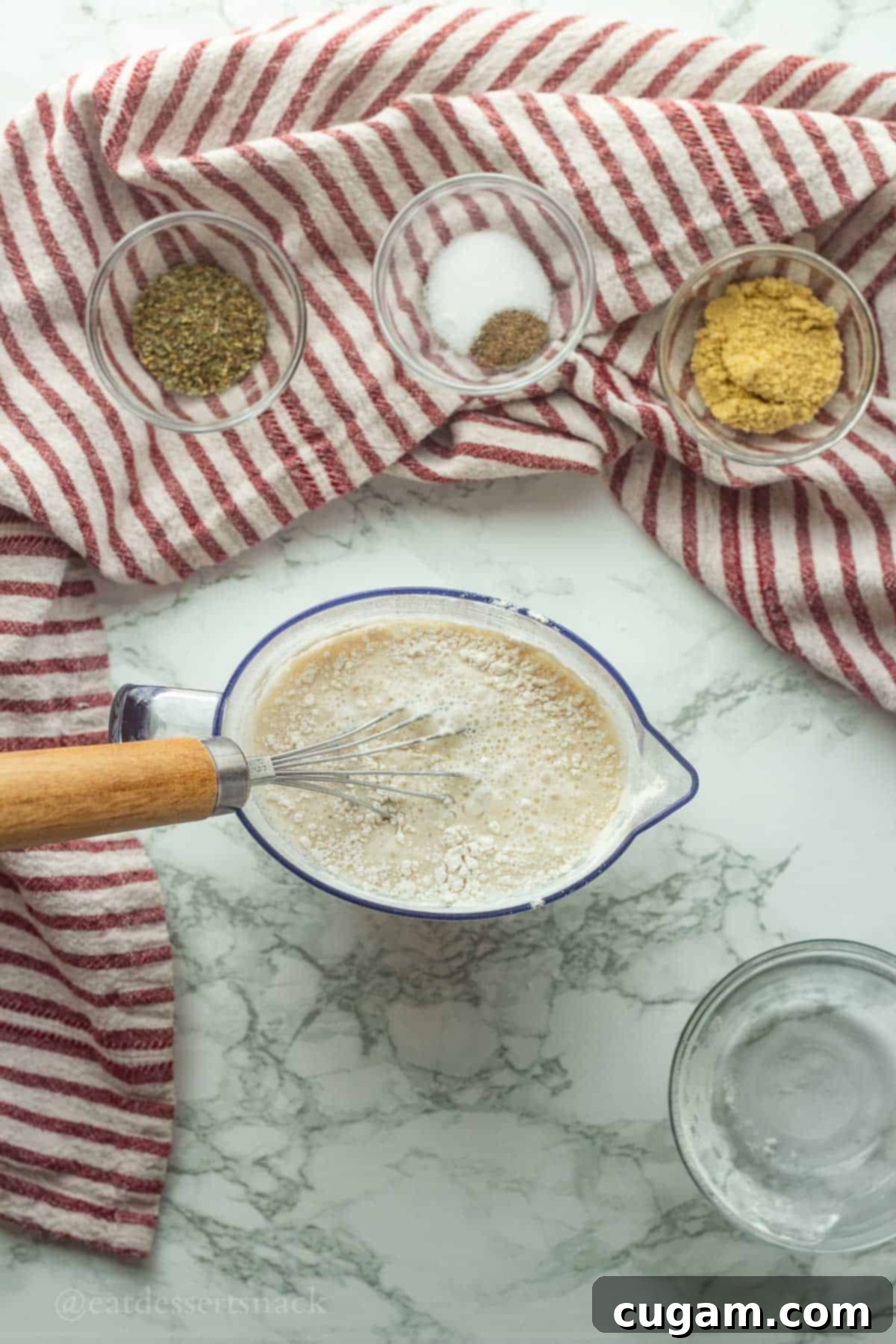 Milk and flour in measuring cup.