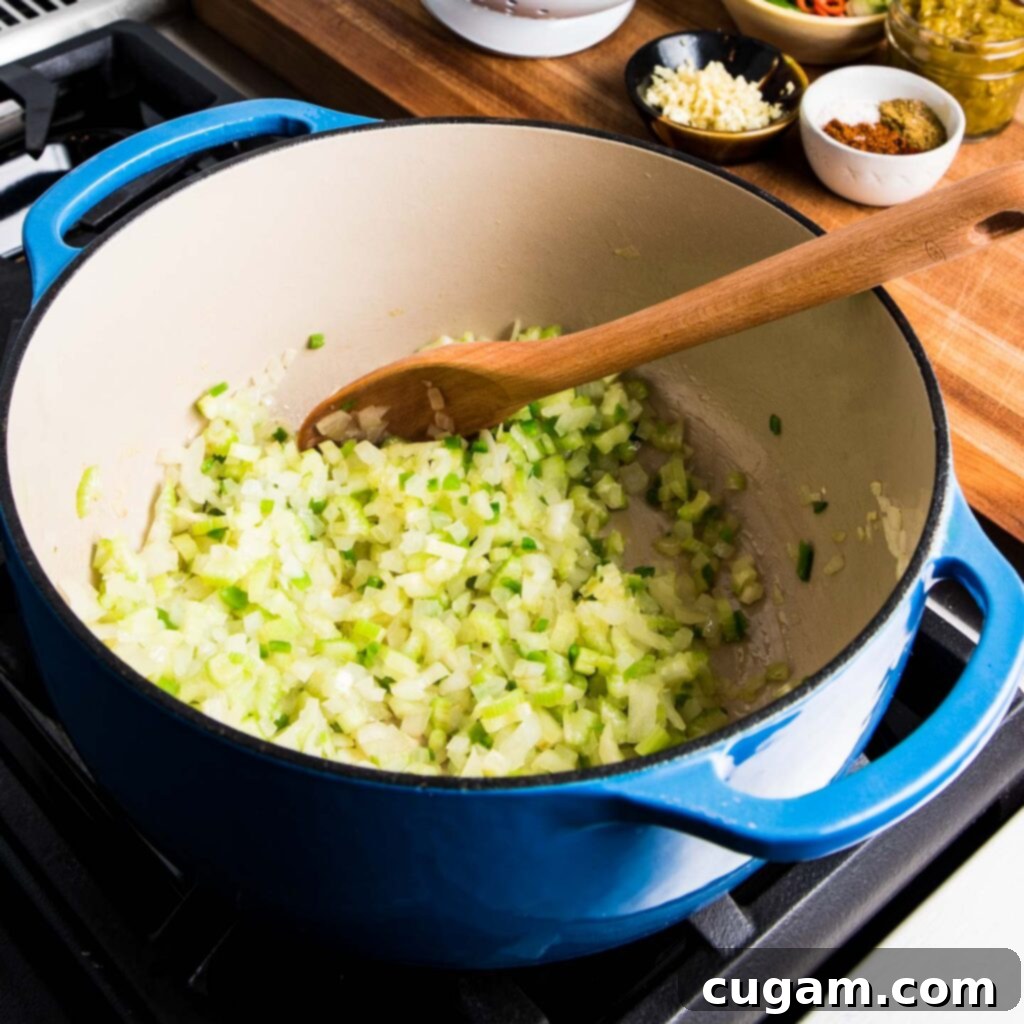 Simple Black Bean Bliss 6 Freshly chopped yellow onion and celery sit on a cutting board, ready for the soup base.