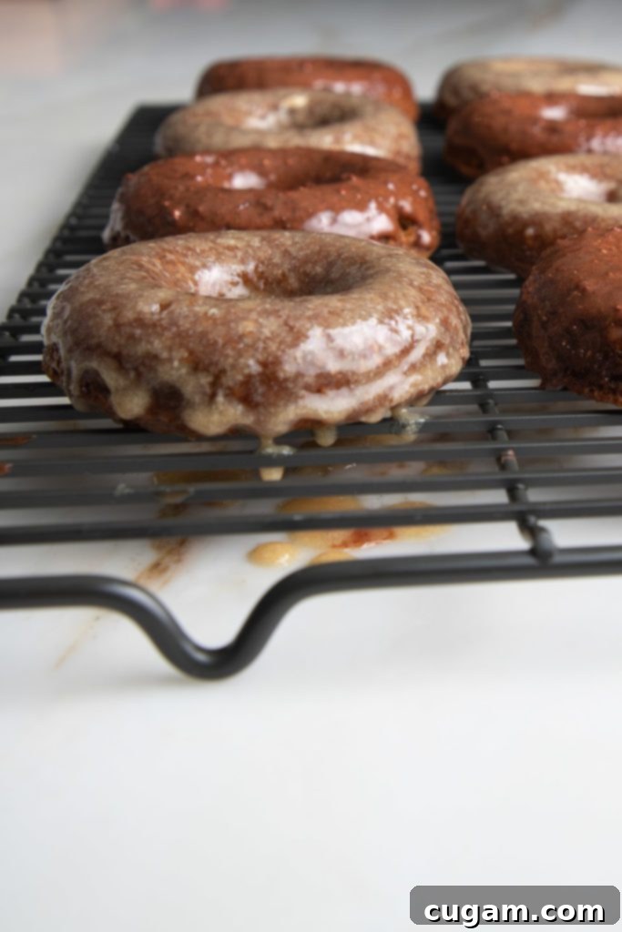 Pumpkin donuts dripping with maple glaze. 
