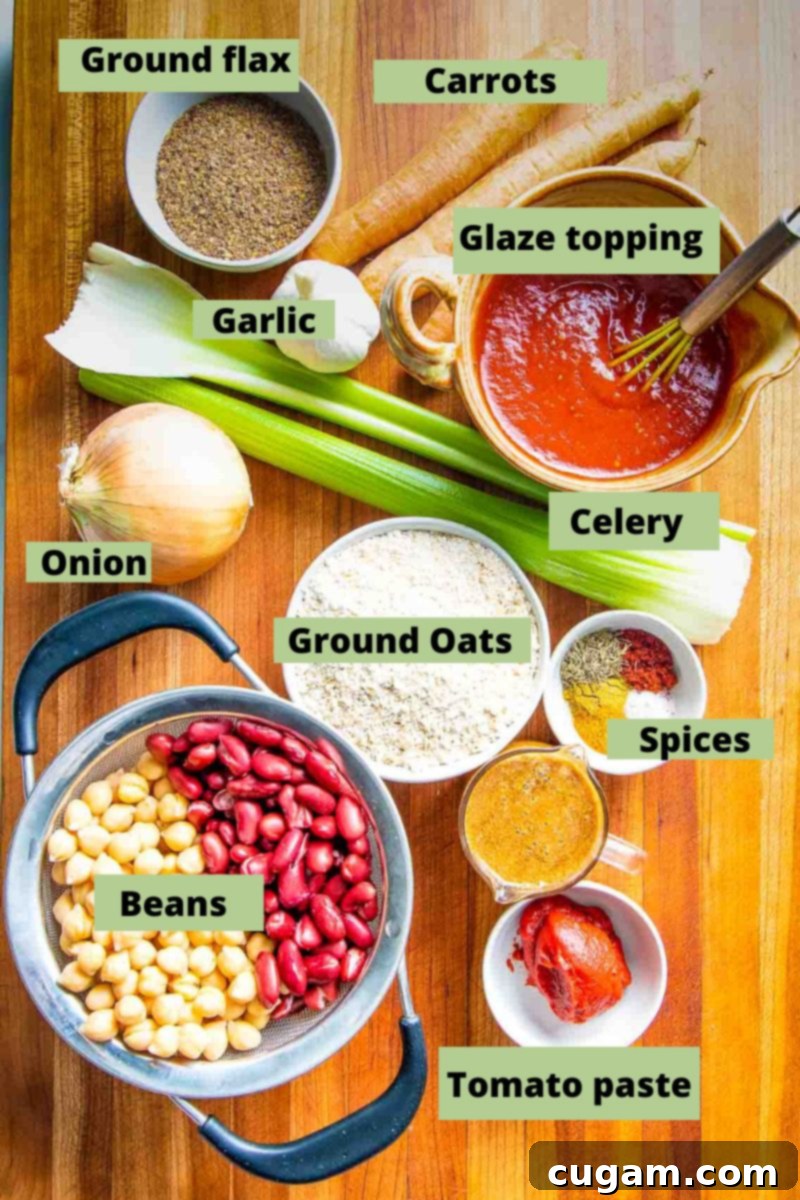 Labeled ingredients including beans, garlic, ground oats, celery, spices, glaze topping, ground flax, and carrots, neatly arranged on a counter.