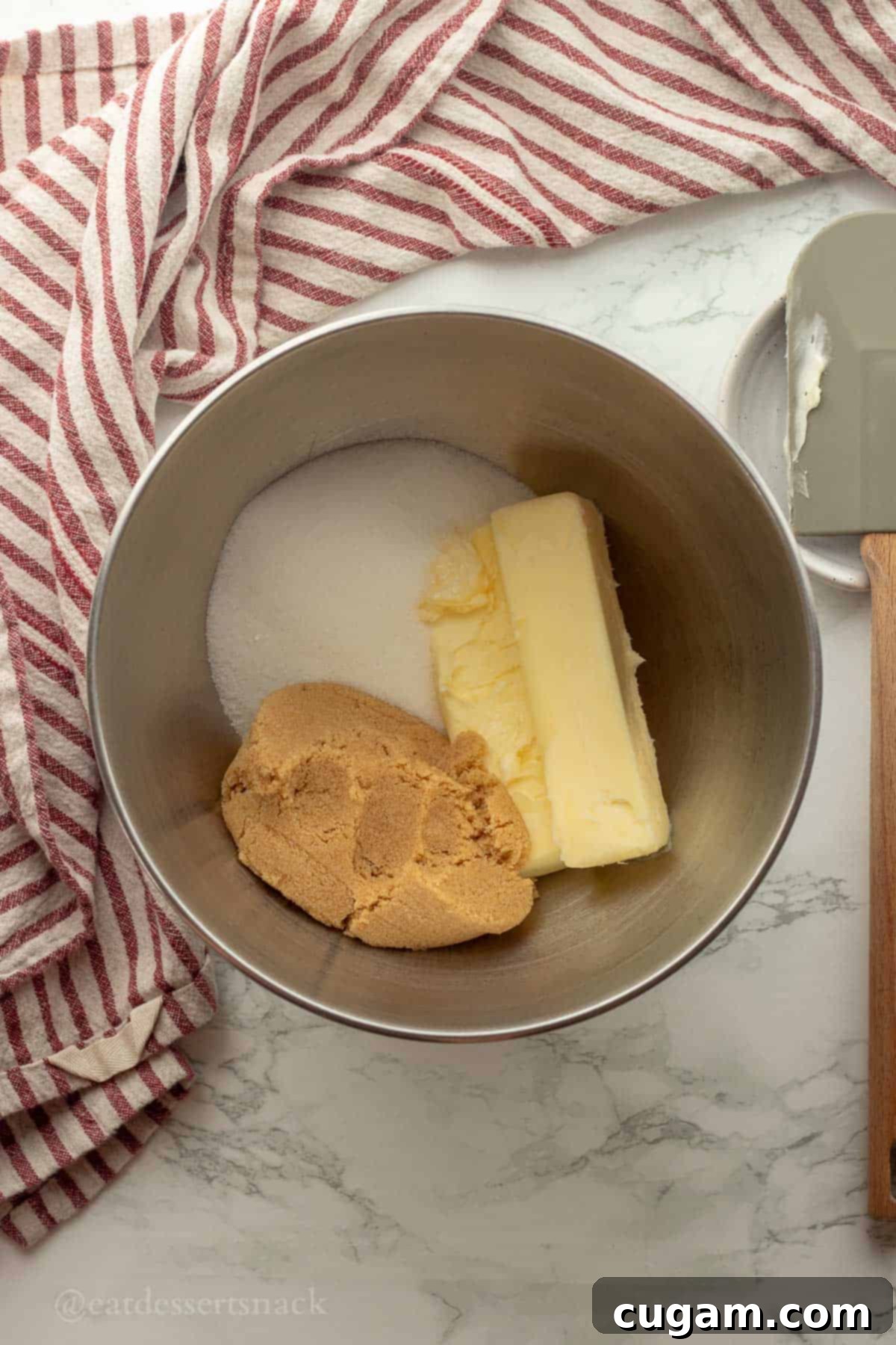 Sourdough Oatmeal Cookies 4 Softened butter and sugars in a metal mixing bowl, ready for creaming.