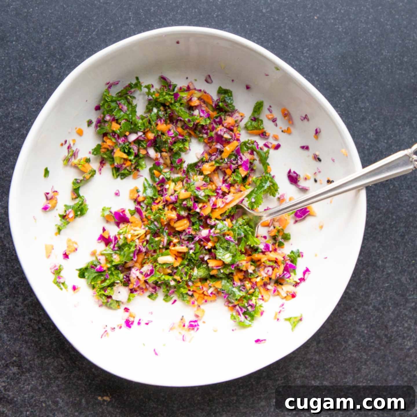 The Ultimate Chopped Salad 10 A large, vibrant bowl of brightly colored chopped vegetables, showcasing their freshness and variety.