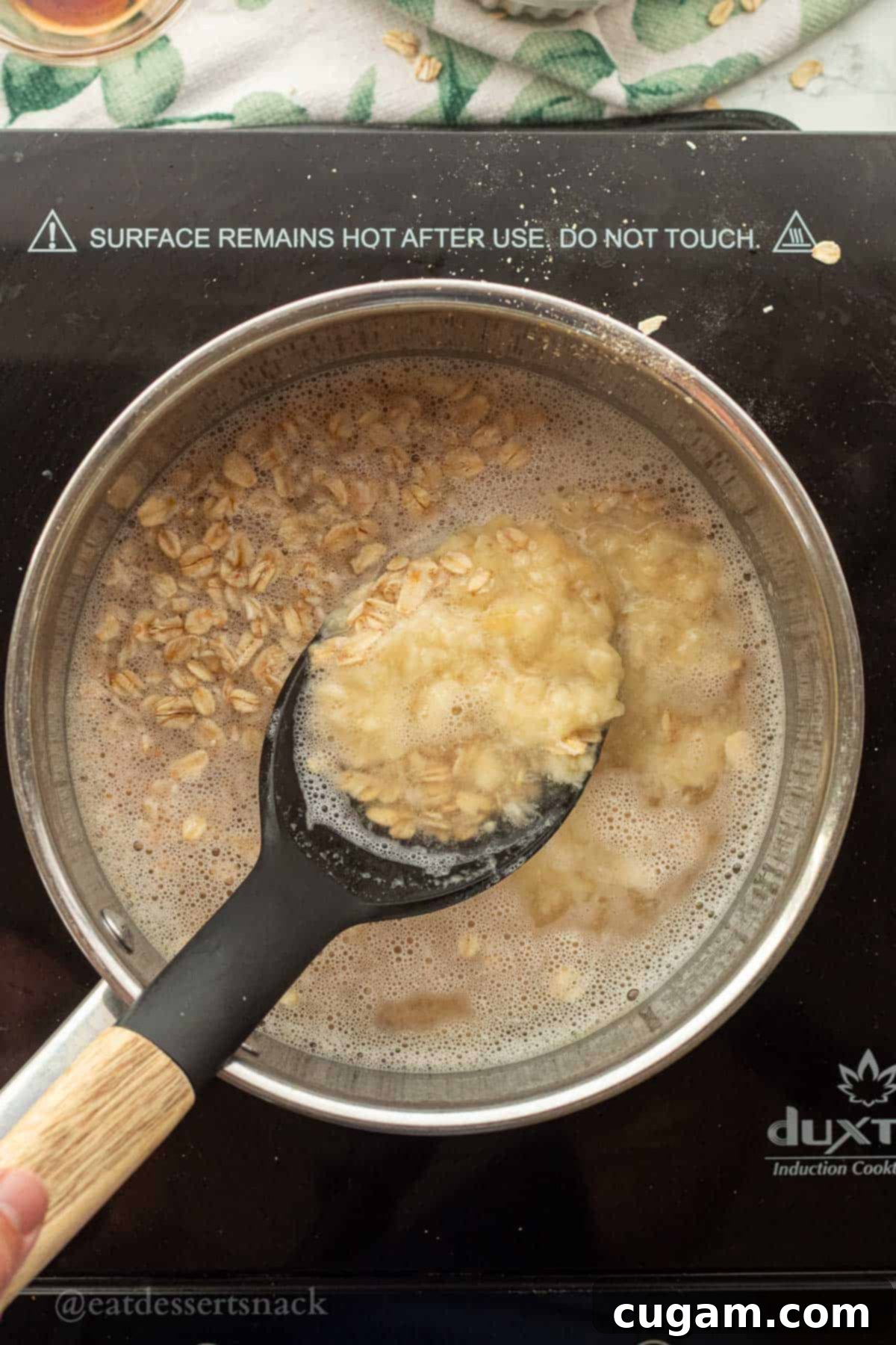 Banana Nut Oatmeal Bliss 6 Mixing mashed banana into oats and water.