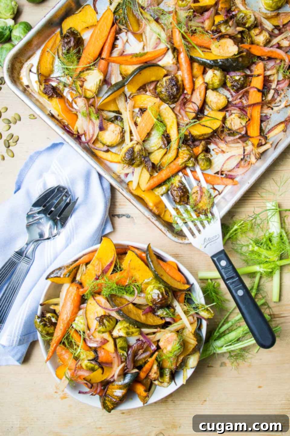 Balsamic roasted root vegetables scooped from sheetpan to beautiful serving bowl. 