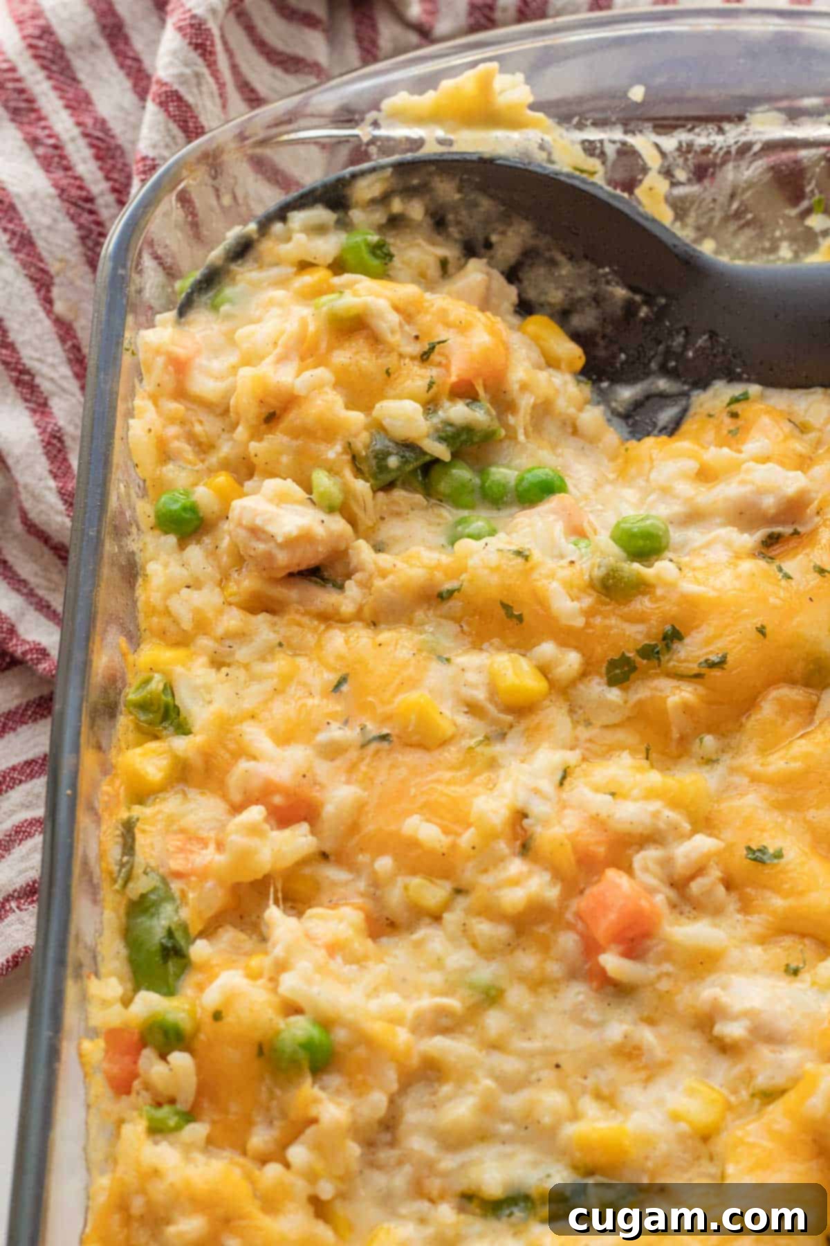 Chicken and Rice Vegetable Casserole 2 Baked Chicken and rice casserole in glass baking dish.