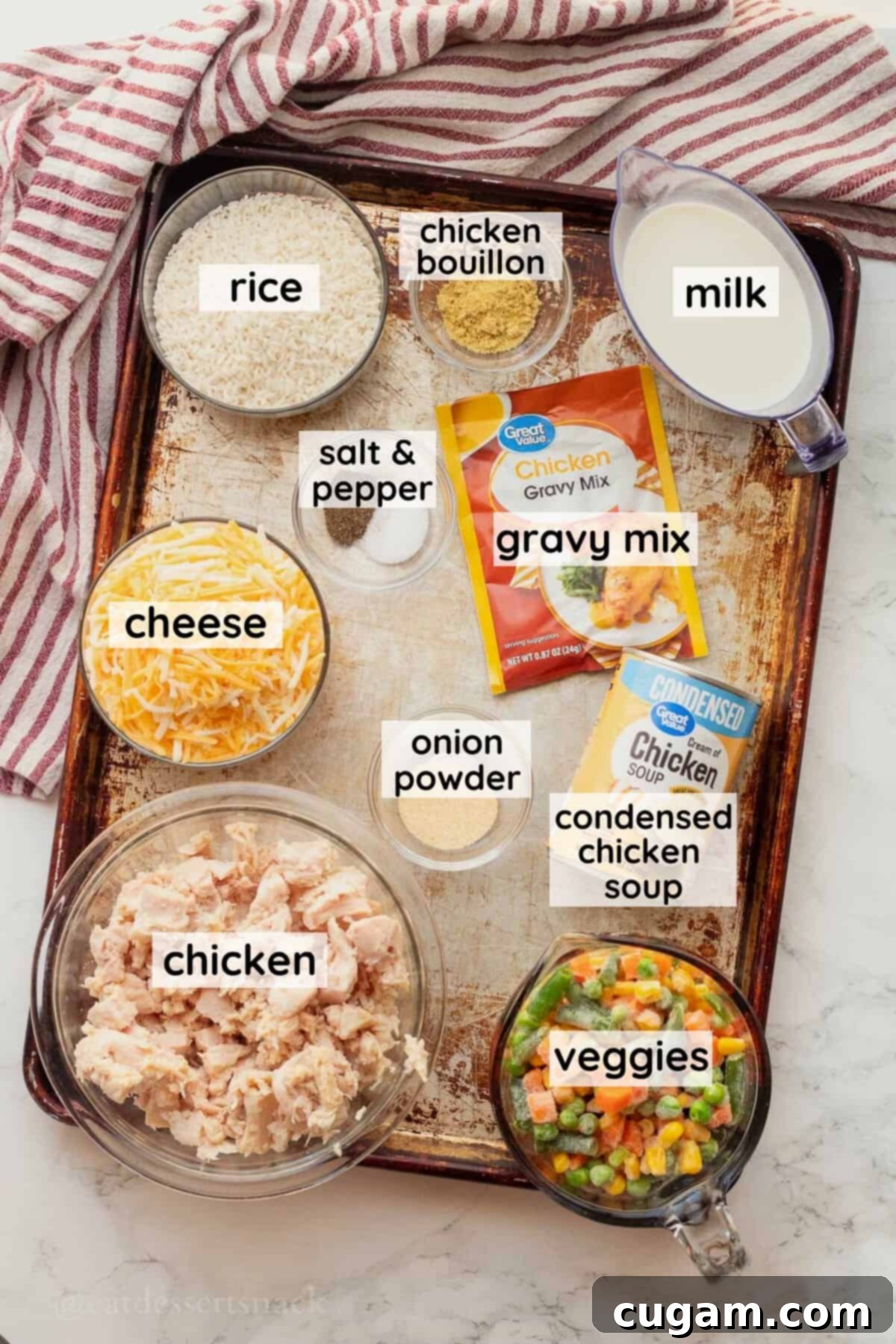Chicken and Rice Vegetable Casserole 3 Labeled ingredients for chicken rice and veggies casserole in glass dishes on metal pan.