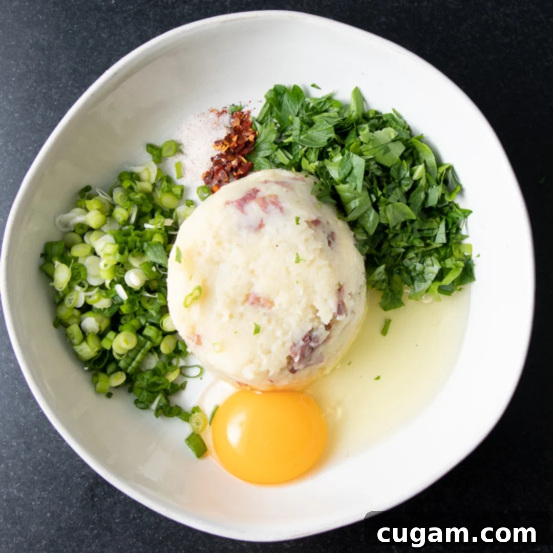 Egg, mashed potatoes and root vegetables, scallions and chopped parsley.