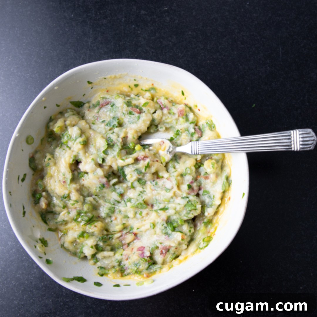 Batter for mashed potato waffles. Loaded with chopped greens.