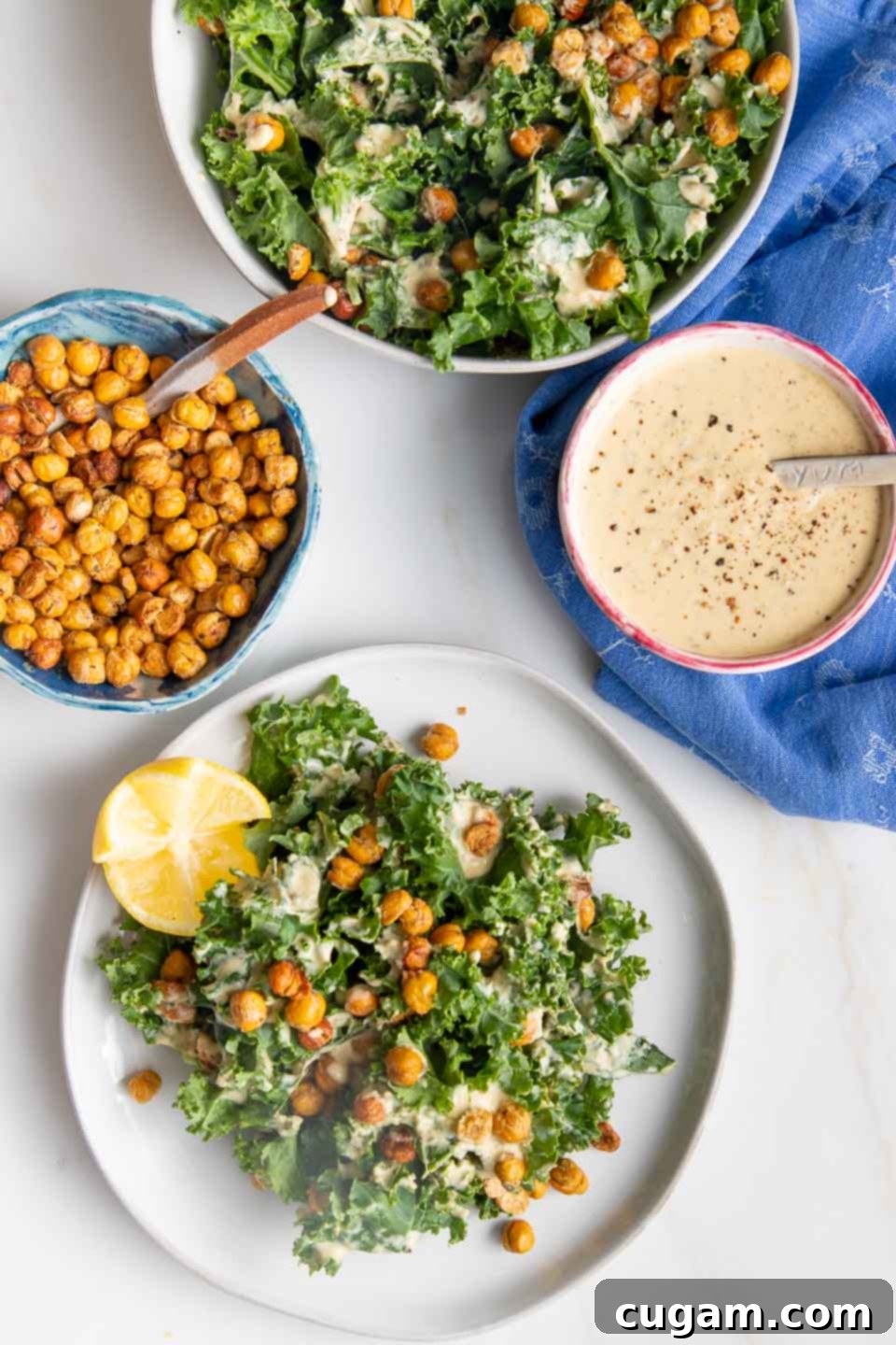 Plate of Salad with chickpea croutons, caesar dressing and lemon