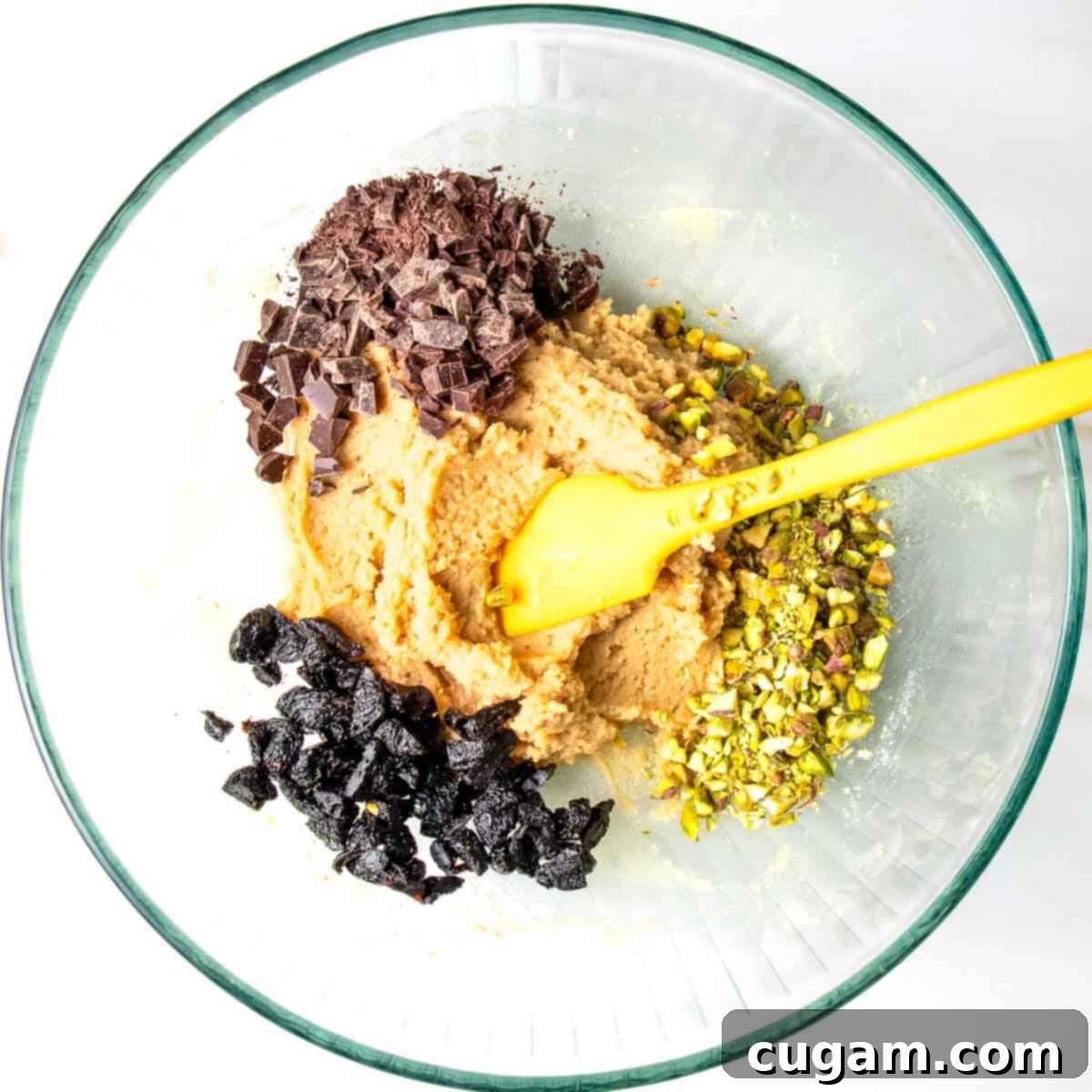 Chewy Vegan Gluten Free Chocolate Chunk Cookies 7 Cookie batter with dark chocolate chunks, chopped pistachios, and dried cherries added.