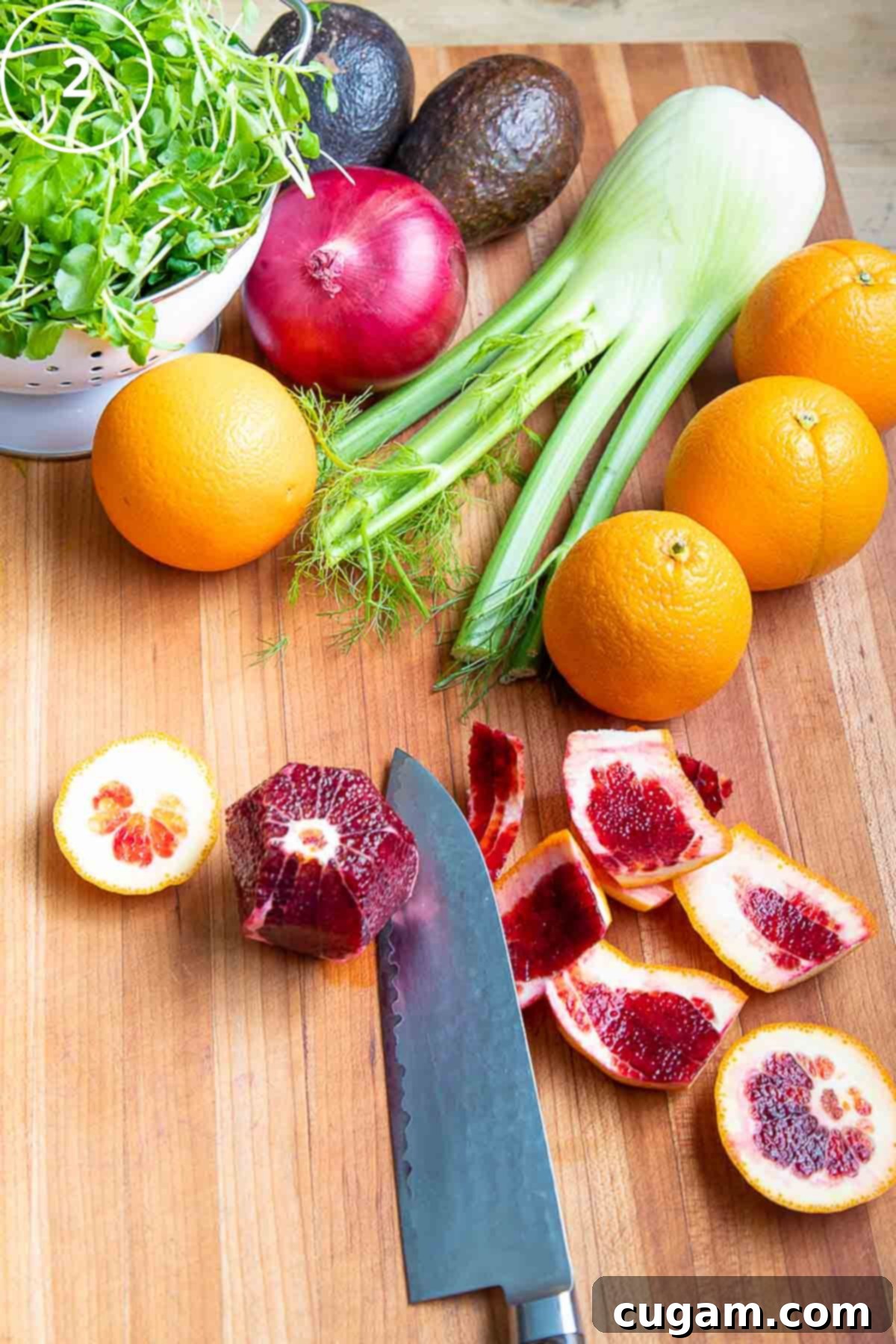 Showing how to cut the peels away from a blood orange. 