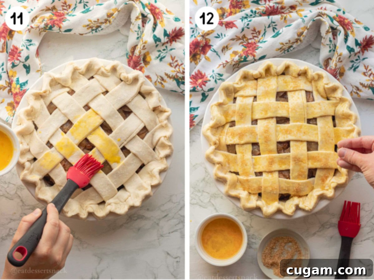 Egg washing raw pie crust with pastry brush and sprinkling coarse sugar on pie crust.