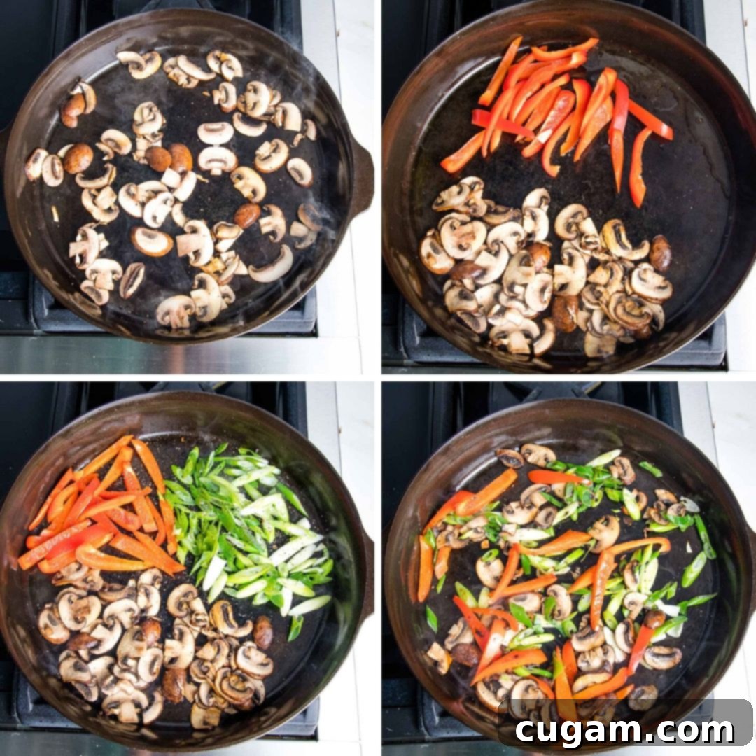 Cast Iron skillet with sauteed mushrooms, red peppers and scallions. 