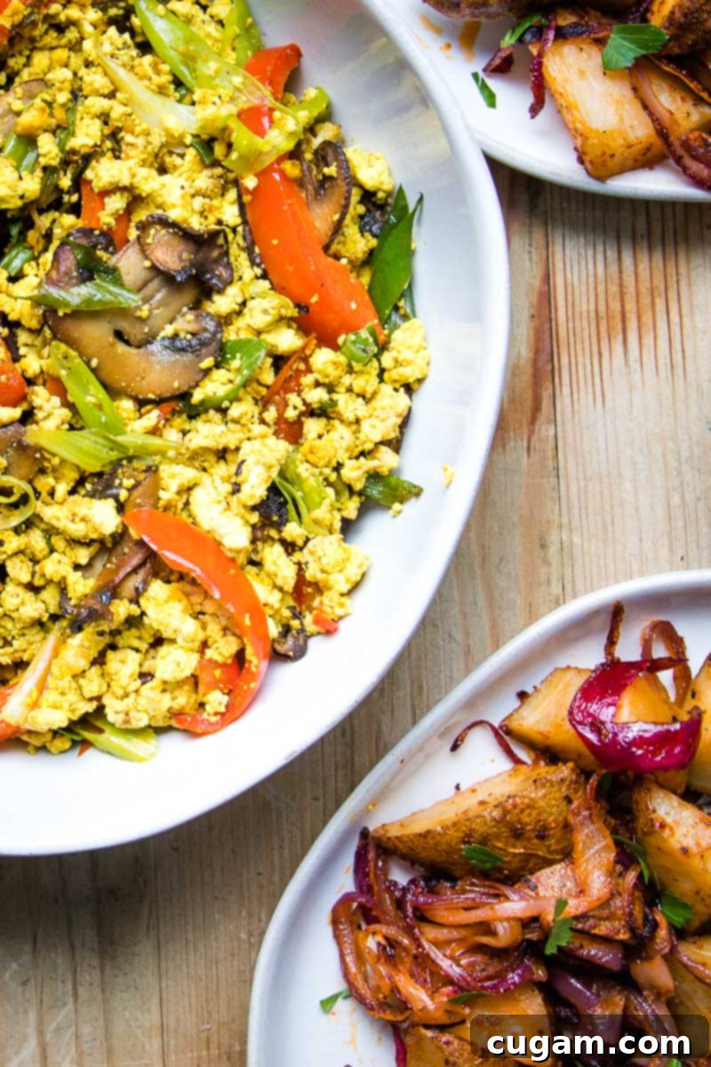 A beautifully plated tofu scramble with a vibrant mix of vegetables, ready to be enjoyed as a wholesome and delicious meal.