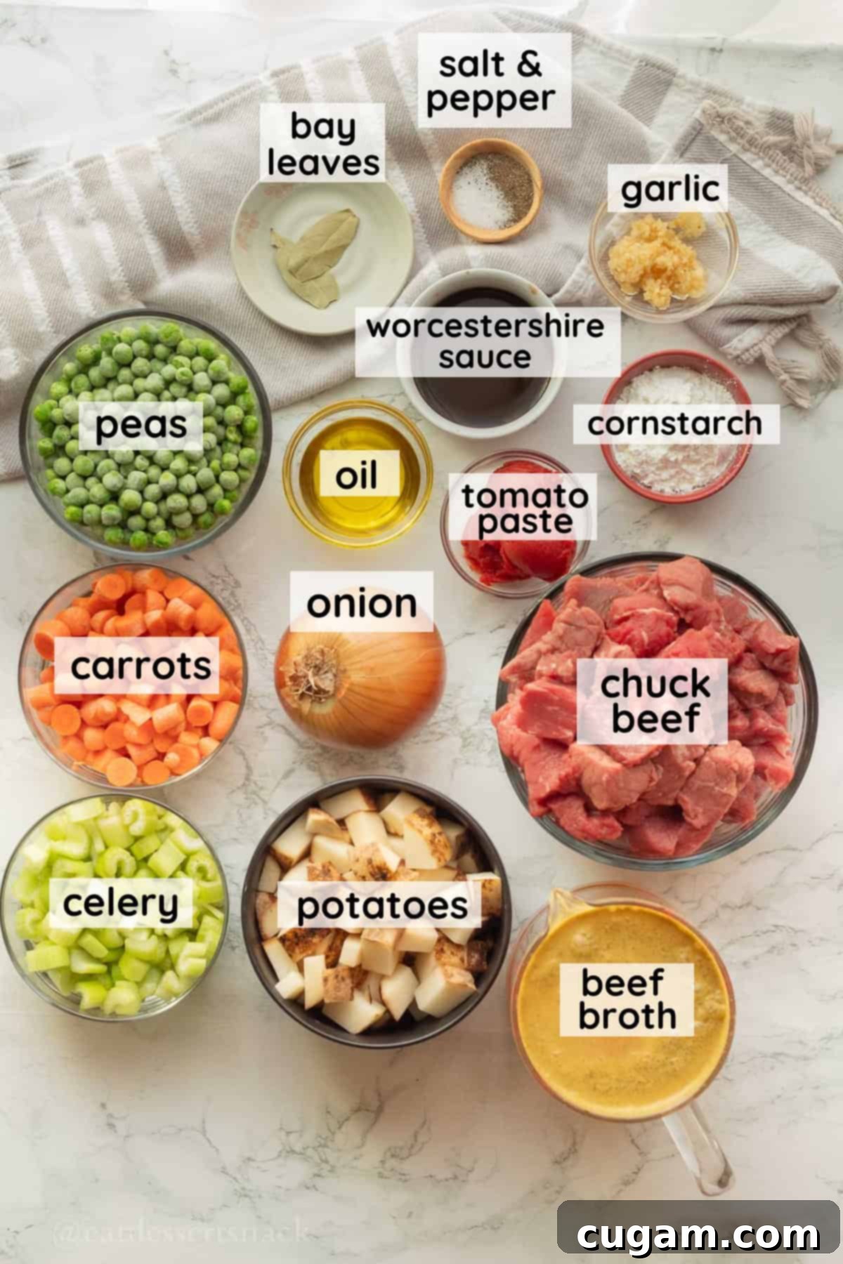 Labeled ingredients for crock pot vegetable beef stew in glass bowls.
