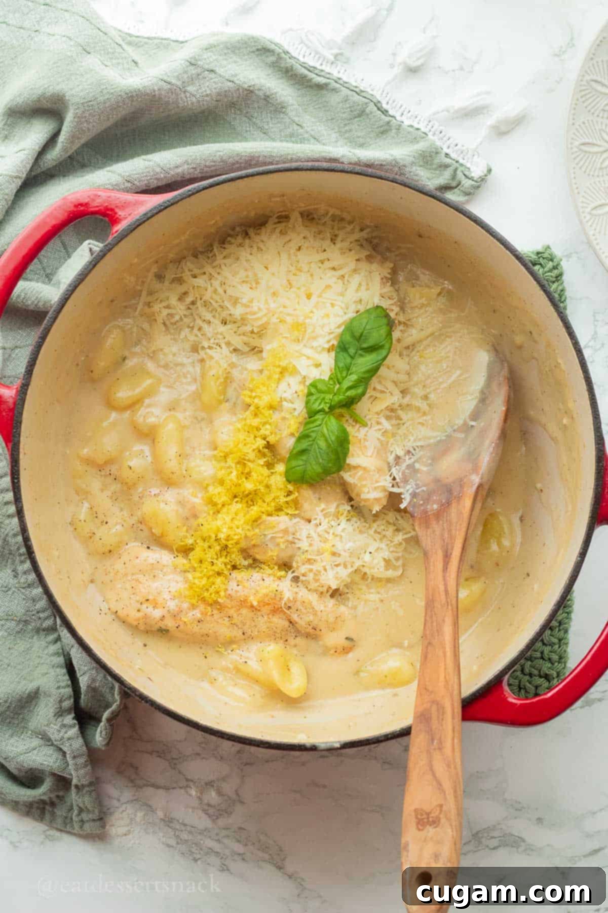 Lemon zest and parmesan on cooked gnocchi and chicken.