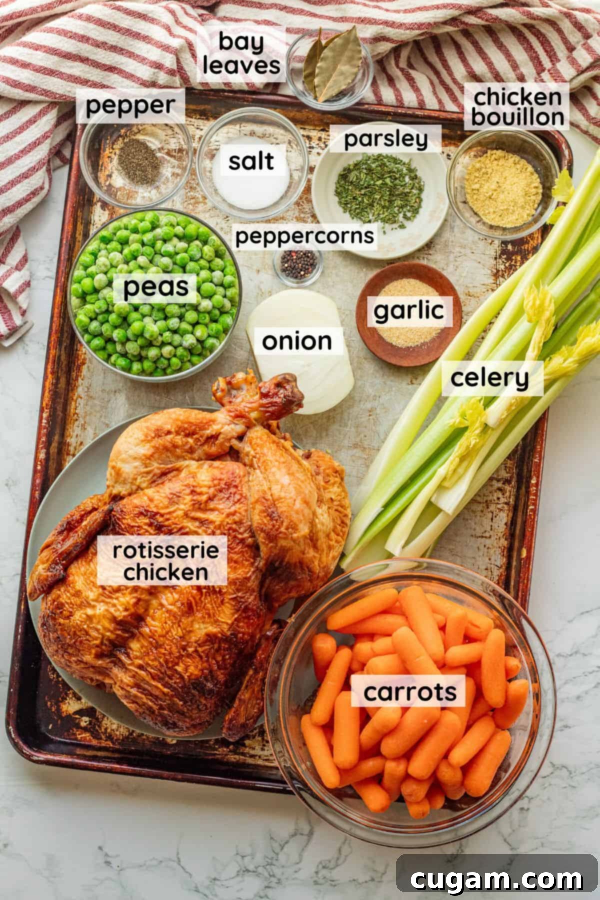 Nourishing Bone Broth Chicken Noodle Soup 3 Labeled ingredients for bone broth chicken noodle soup on metal pan in glass bowls.