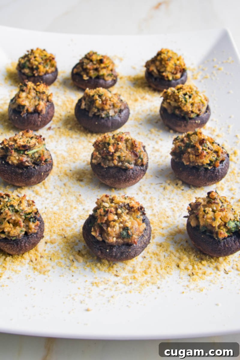 Golden gluten-free stuffed mushrooms on a platter