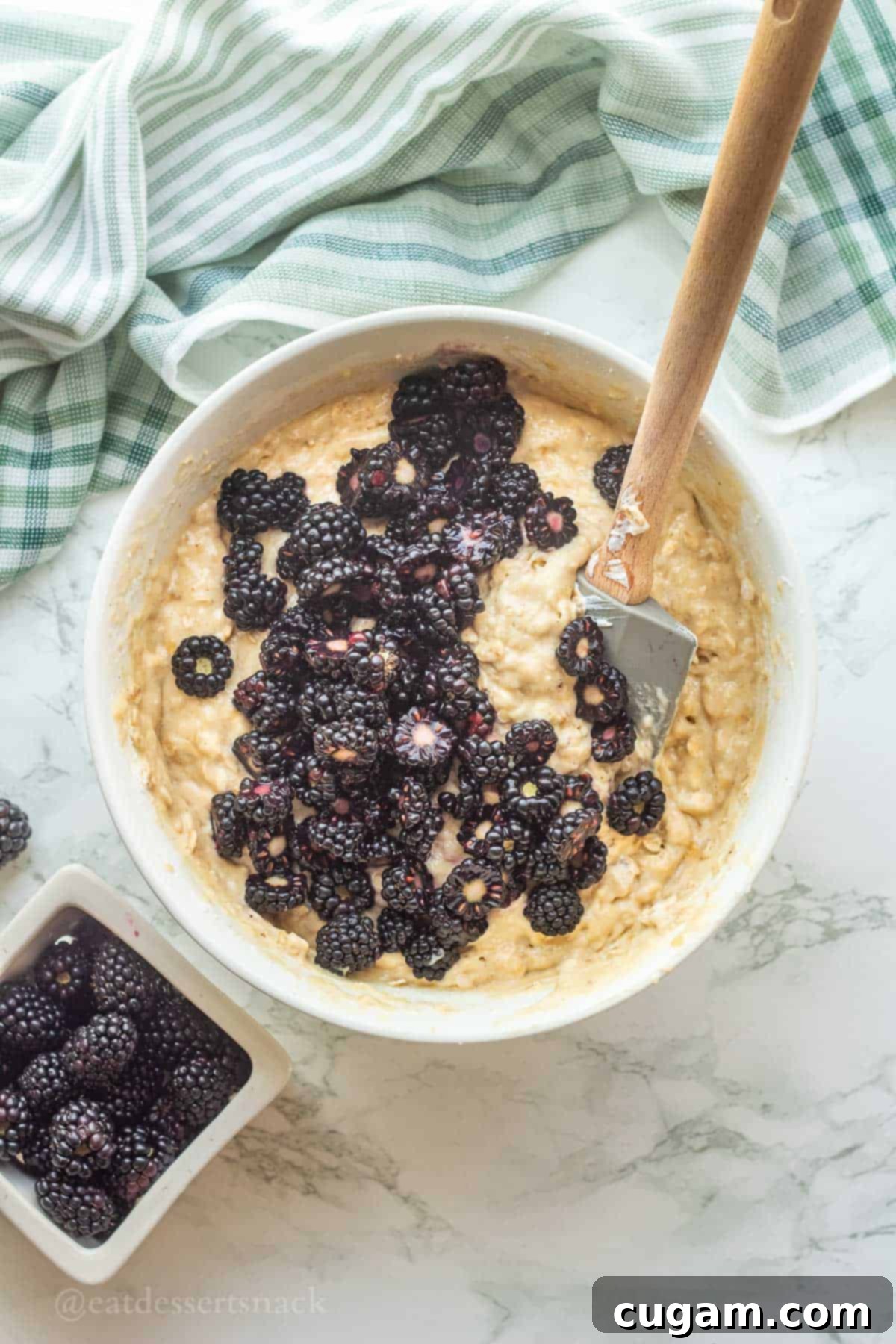 Blackberries in raw banana oat muffin batter.