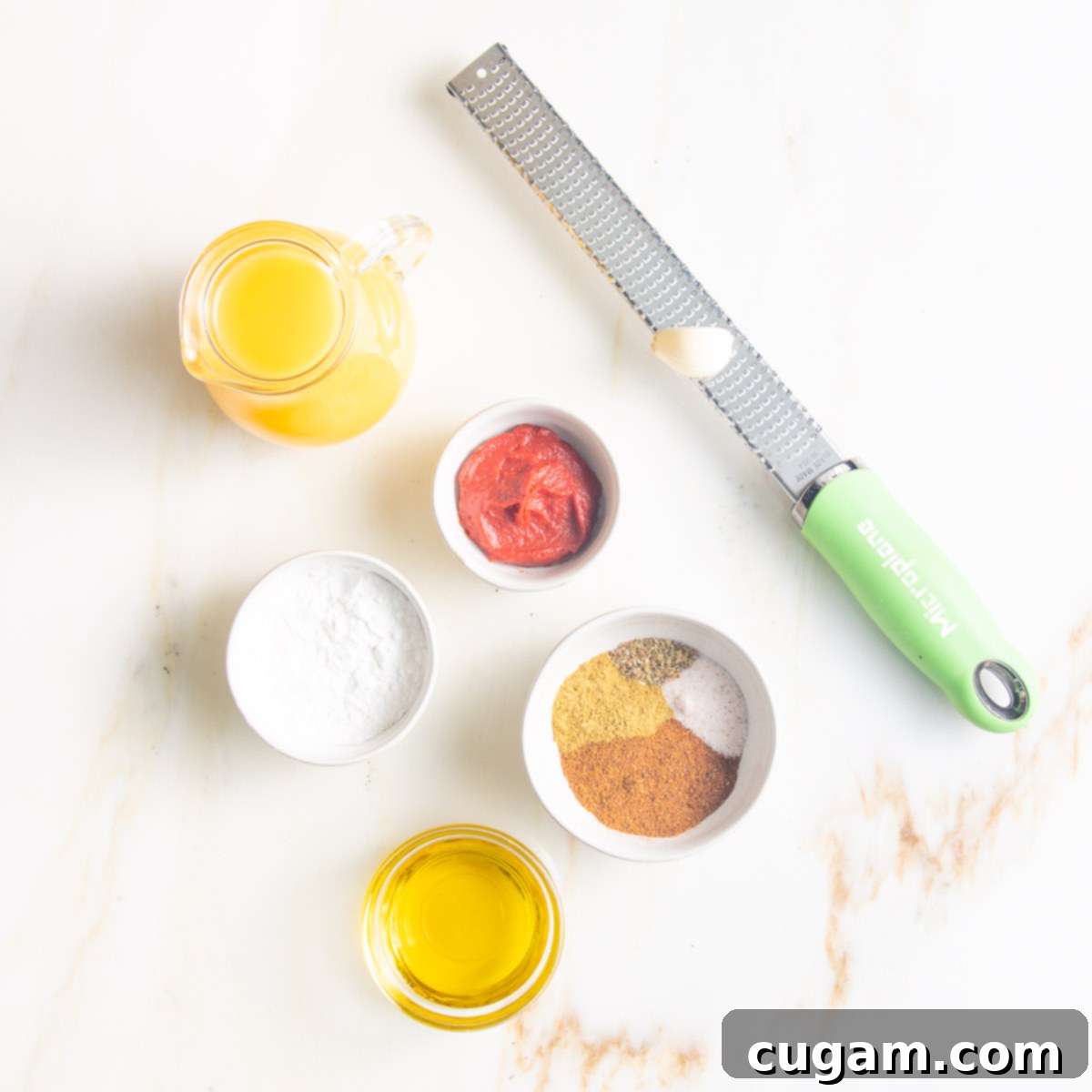 Ingredients: pitcher of veggie stock, microplane with garlic, arrowroot powder, tomato paste, olive oil, spices. 