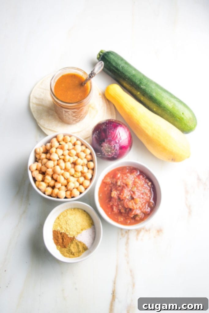 Ingredients for enchilada casserole: beans, onion, zucchini, spices, enchilada sauce, salsa 