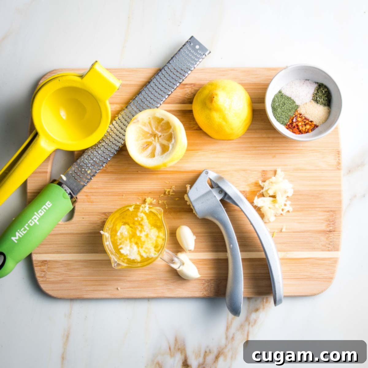 A vibrant scene of marinade preparation, showing a hand juicing a fresh lemon, another pressing garlic, and a small bowl filled with various spices ready to be whisked together.