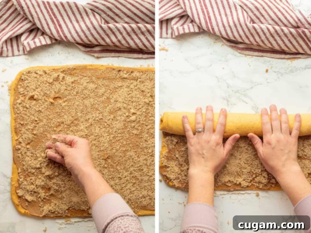 Sprinkling brown sugar over pumpkin dough with filling and rolling up filling inside dough, lengthwise.