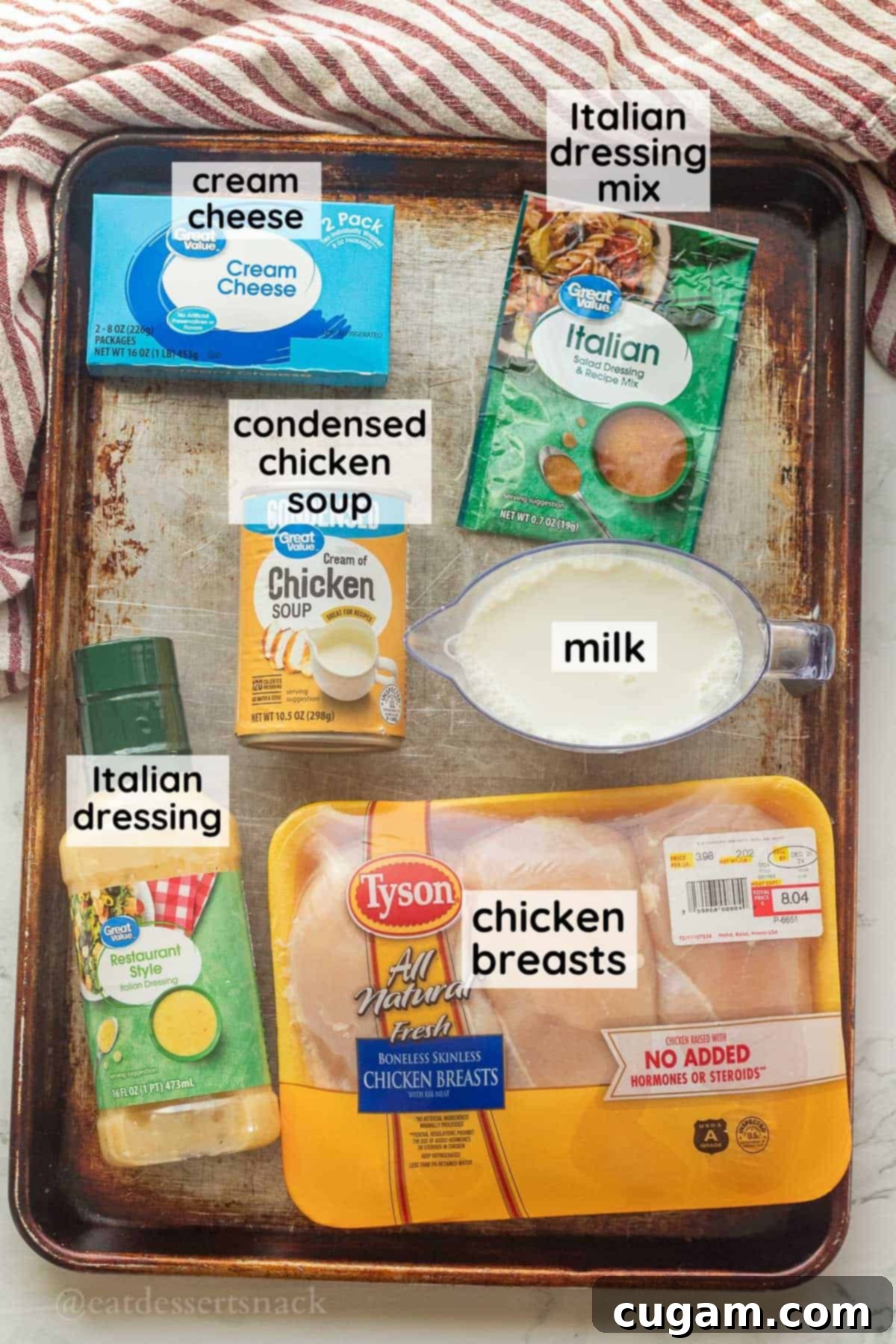 Labeled ingredients for crockpot italian chicken in glass bowls on metal pan.