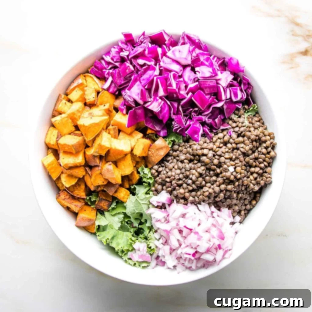 Finely diced purple onion, providing a sharp and flavorful kick to the salad.