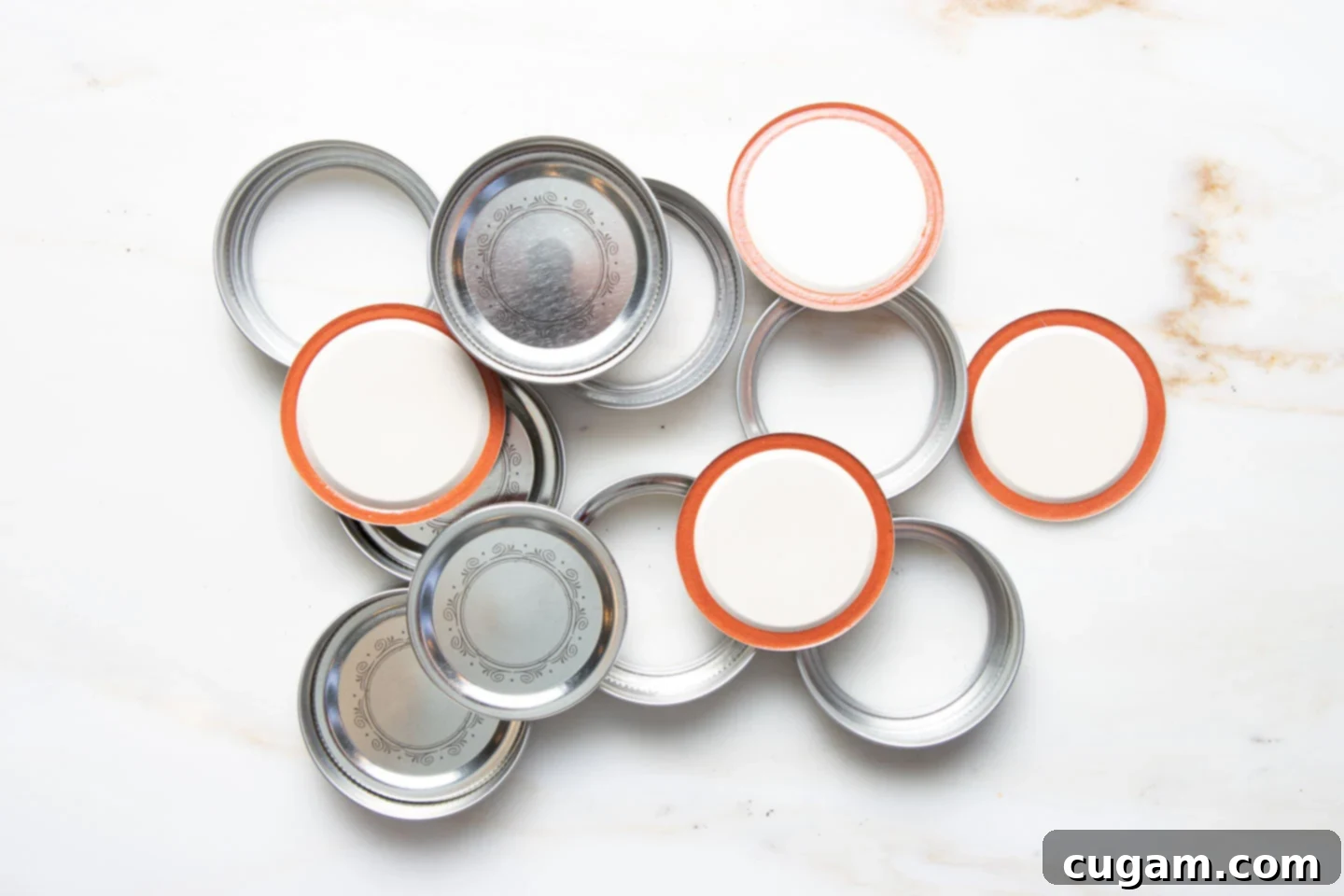 An assortment of canning jar lids and rings. 