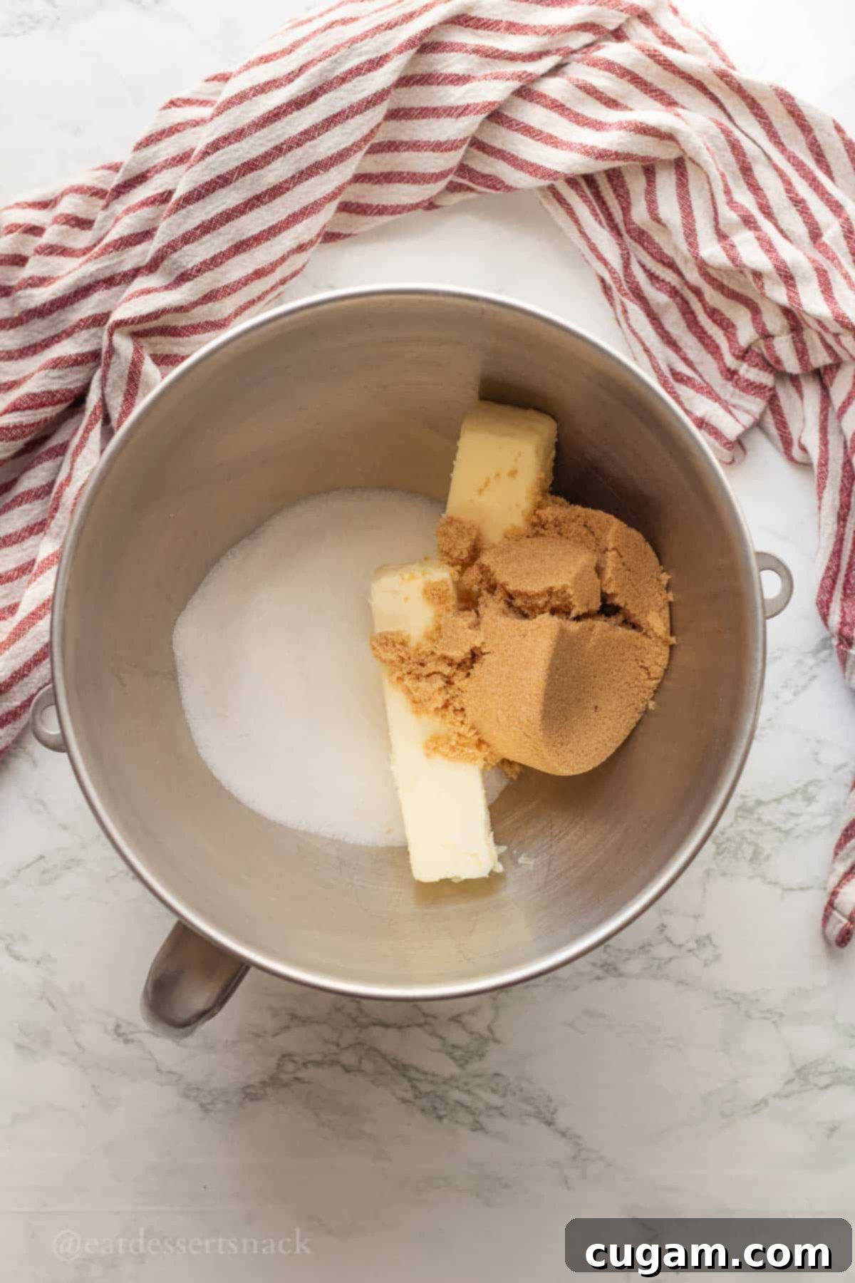 Eggs, brown sugar, and white sugar in mixing bowl.