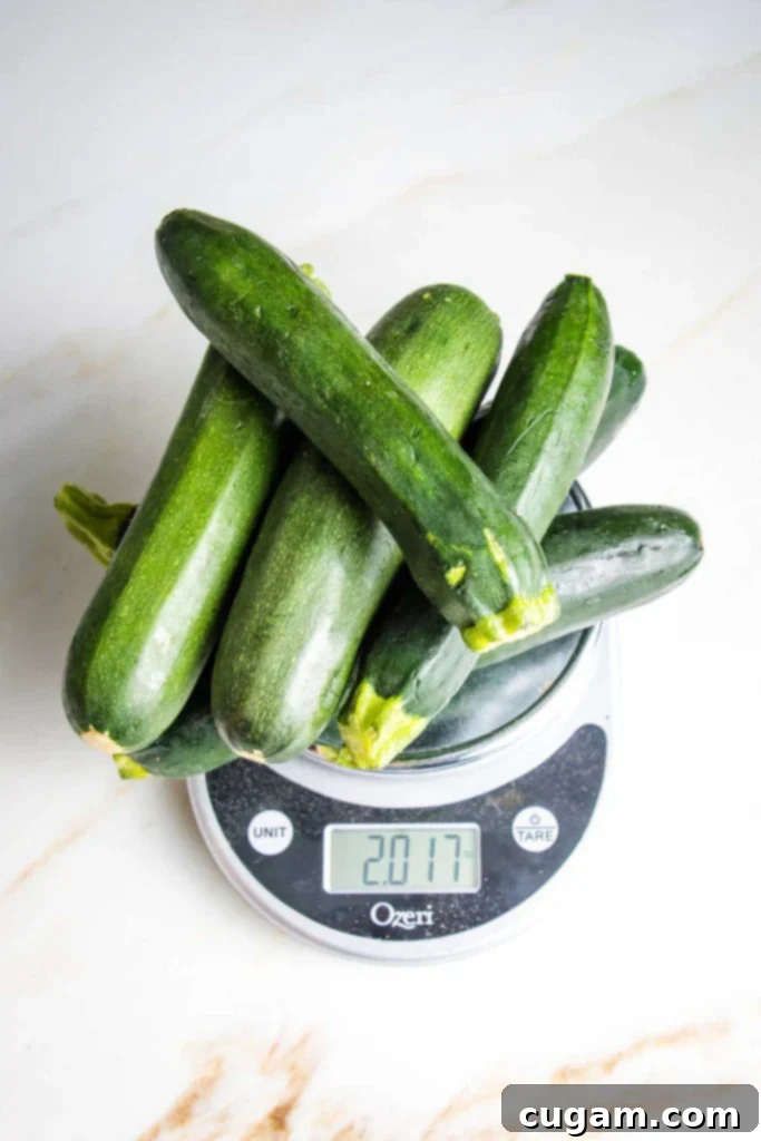 Easy Creamy Zucchini Soup 3 Pile of zucchini on top of a scale that reads 2lbs.