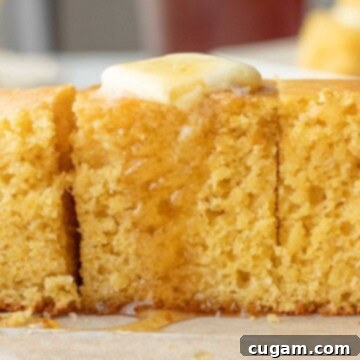 Buttered and honey-drizzled slices of Sourdough Discard Cornbread, golden and moist.