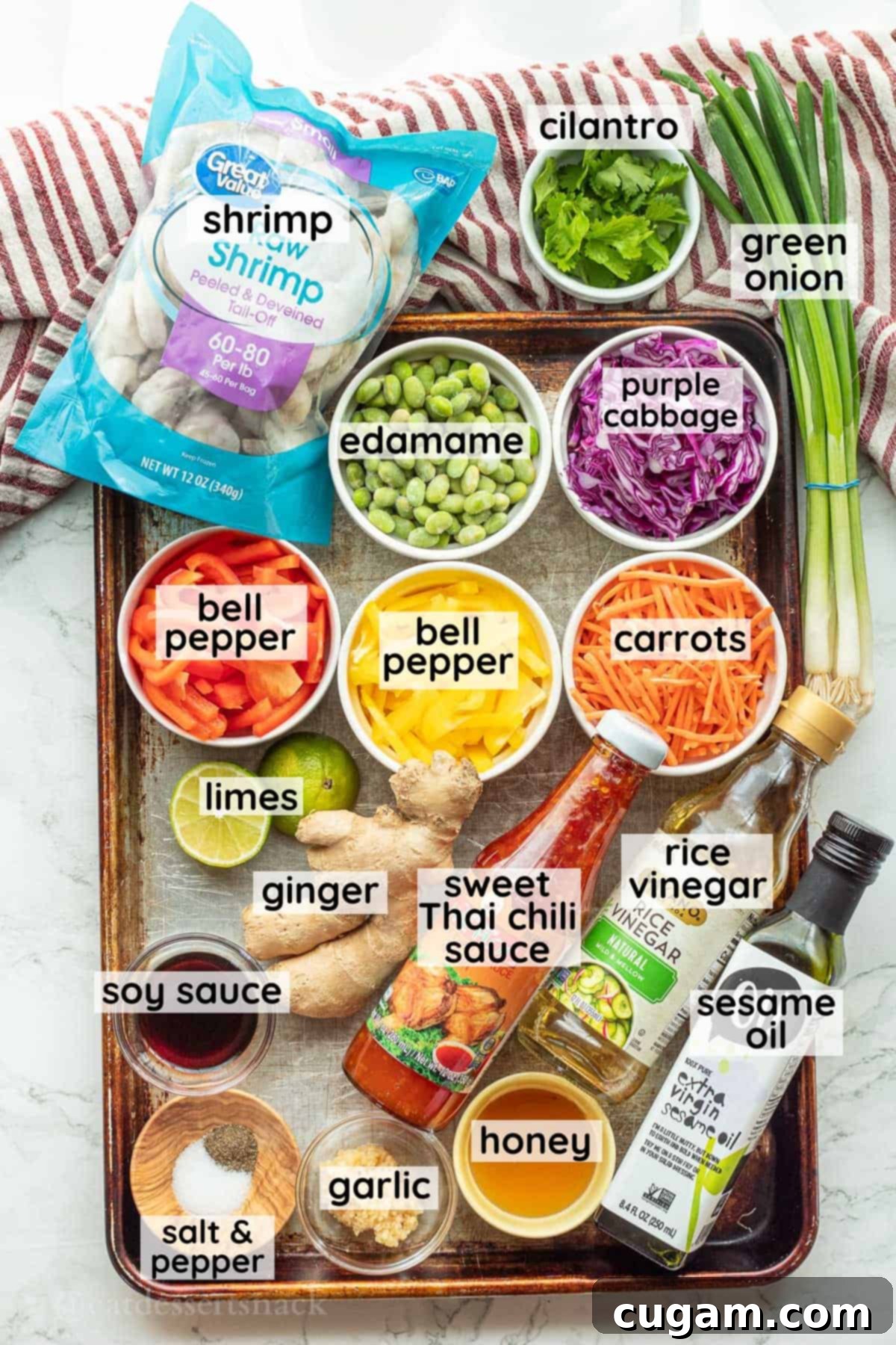 Labeled ingredients for spring roll salad on metal pan in glass bowls.