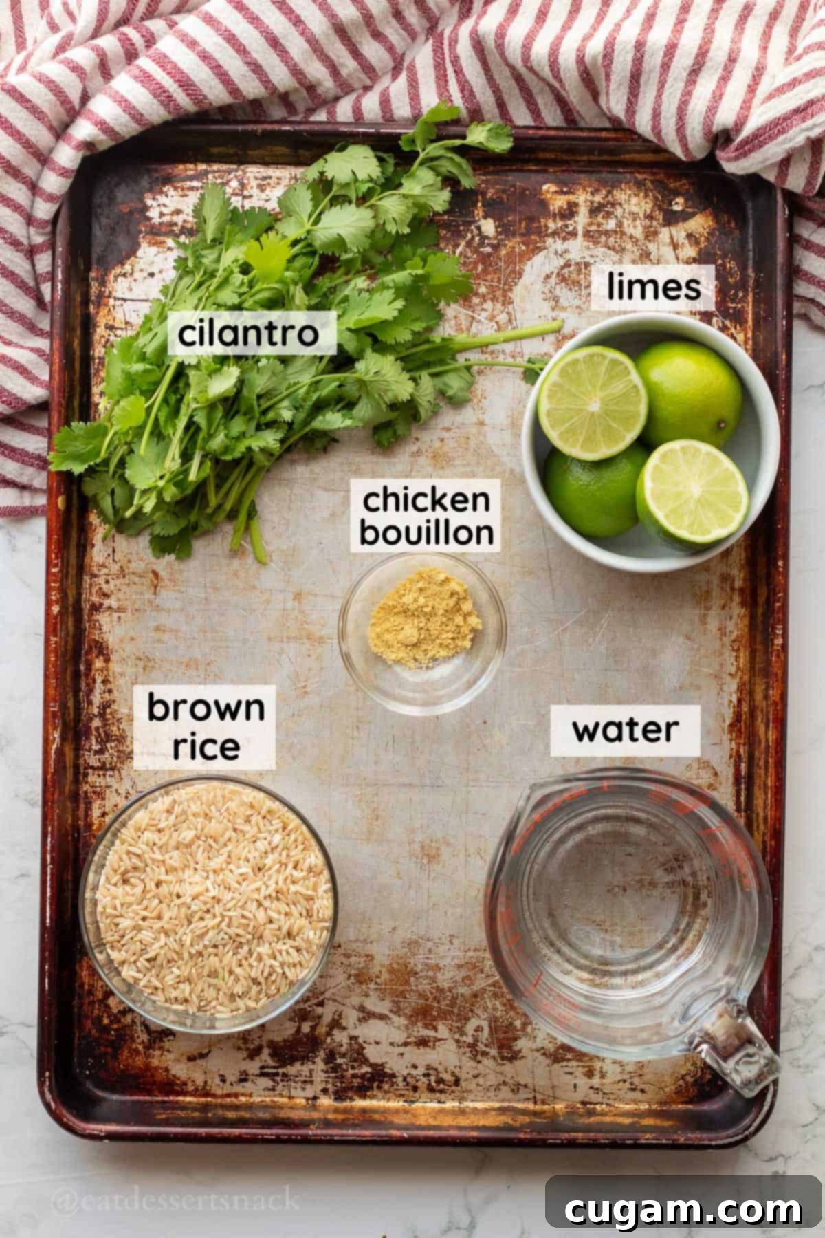 Labeled ingredients for cilantro lime brown rice on metal pan in glass bowls.