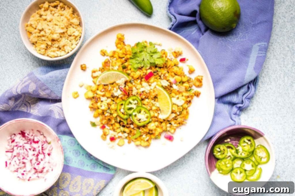Delicious Vegan Mexican Street Corn 15 Close-up of the finished Vegan Mexican Street Corn Salad in a bowl, showing charred corn and fresh ingredients.