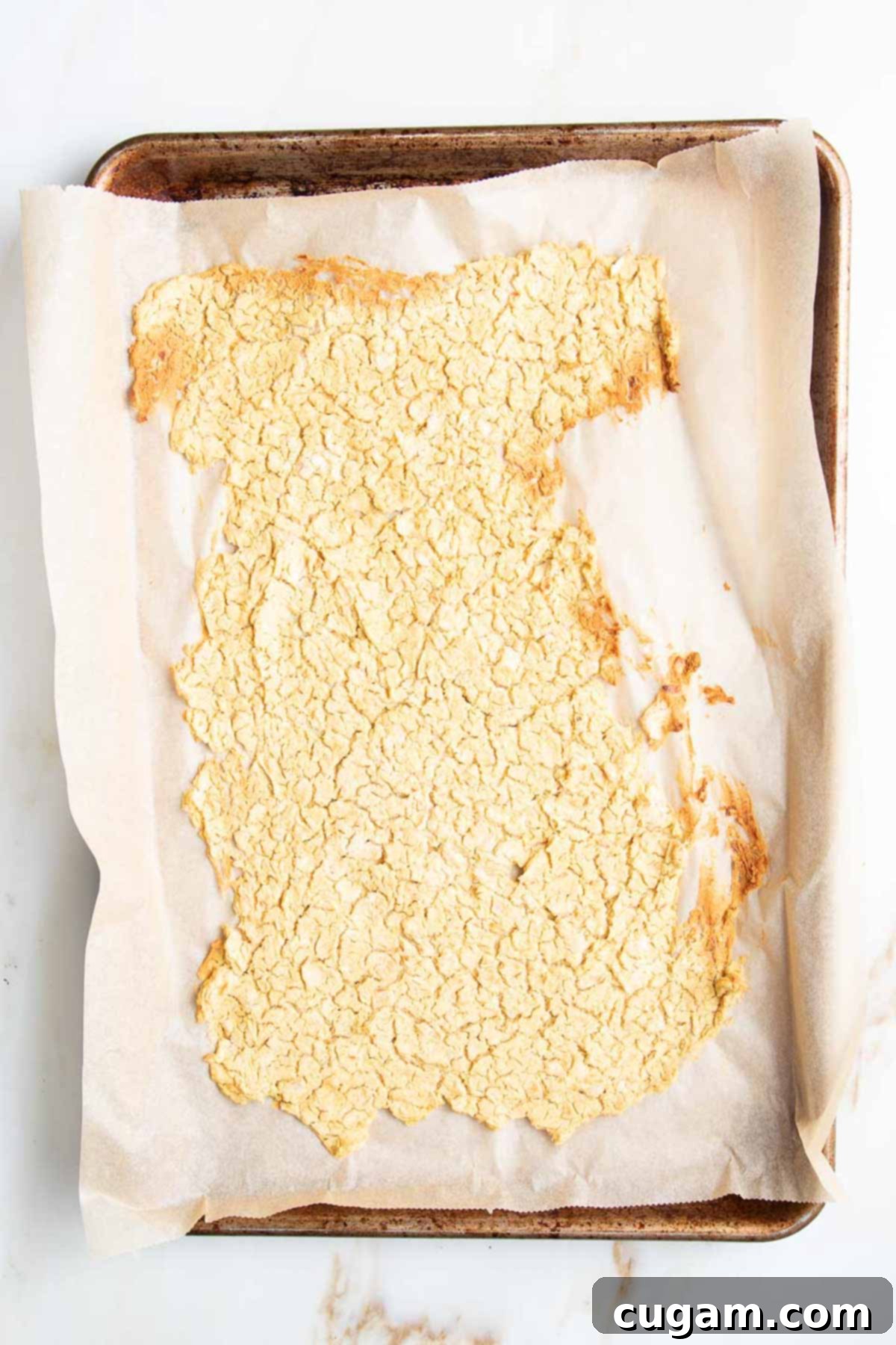 Delicious Vegan Mexican Street Corn 10 The vegan cheese paste baked until dry, but not burnt, on a baking sheet.