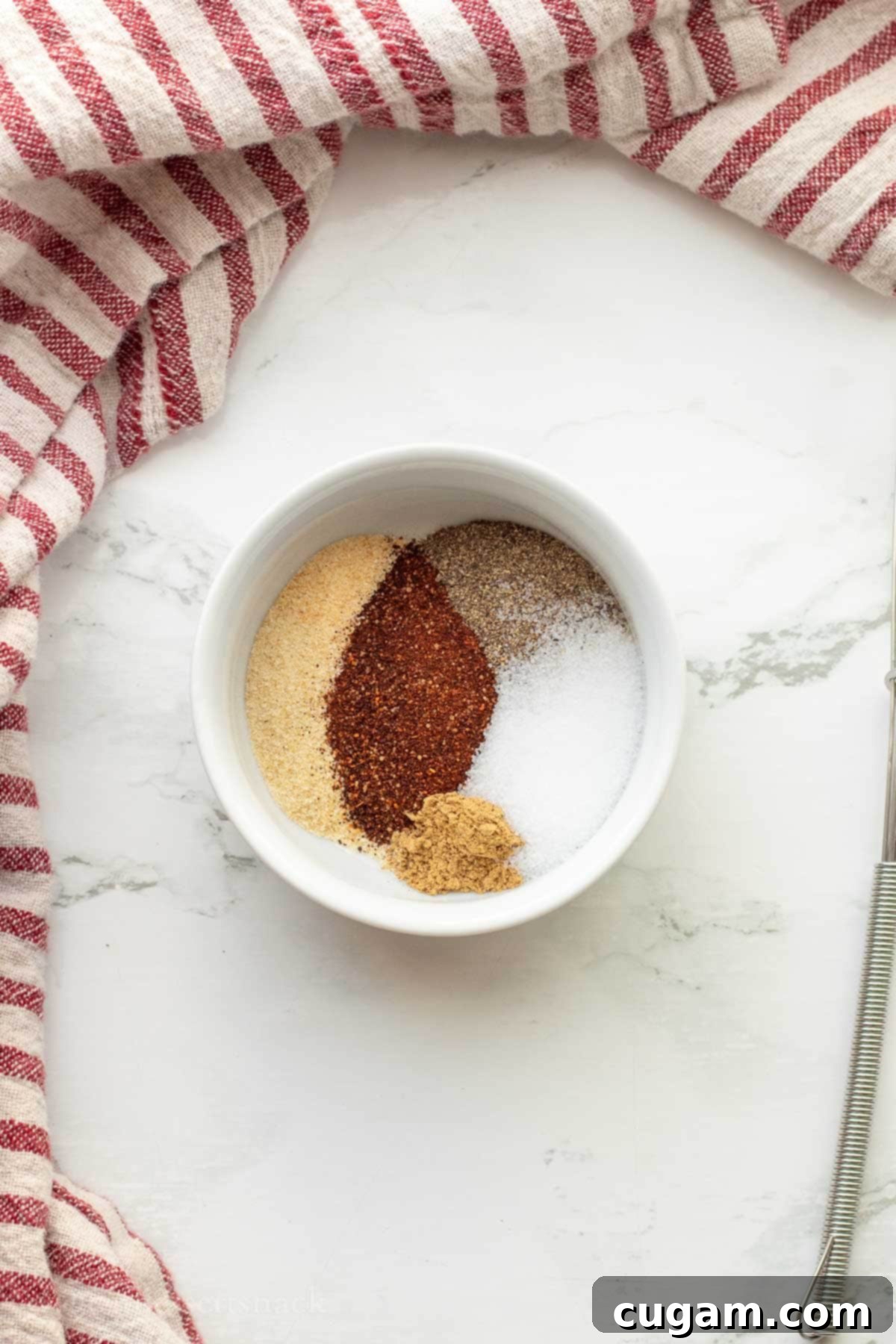DIY Chicken Taco Spice Mix 2 White bowl of spices on marble.