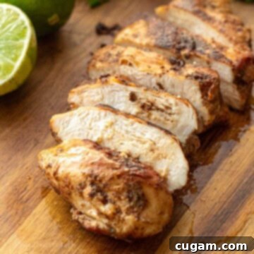 DIY Chicken Taco Spice Mix 10 Cooked chicken sliced on wood cutting board.