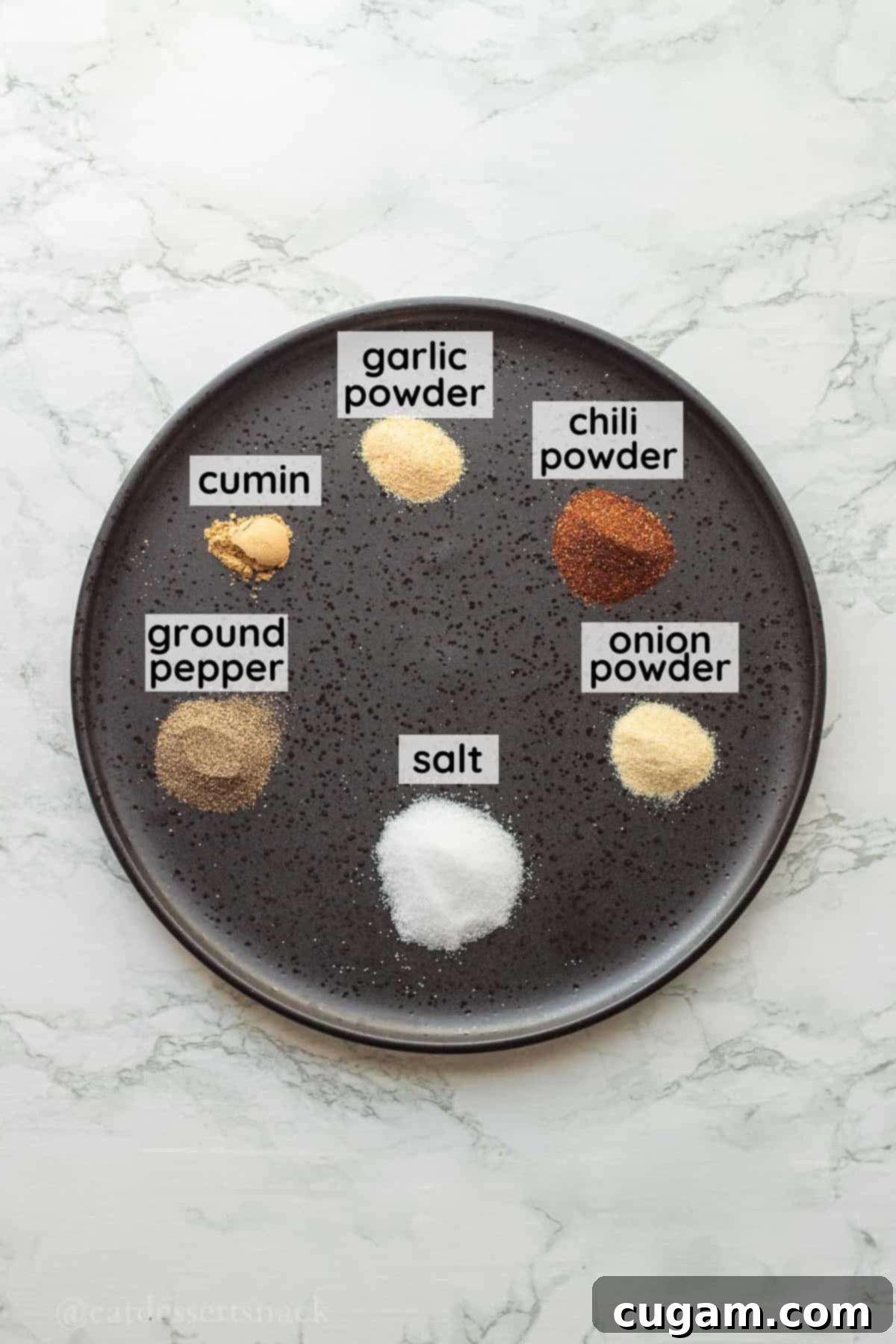 DIY Chicken Taco Spice Mix 3 Spices on black plate.