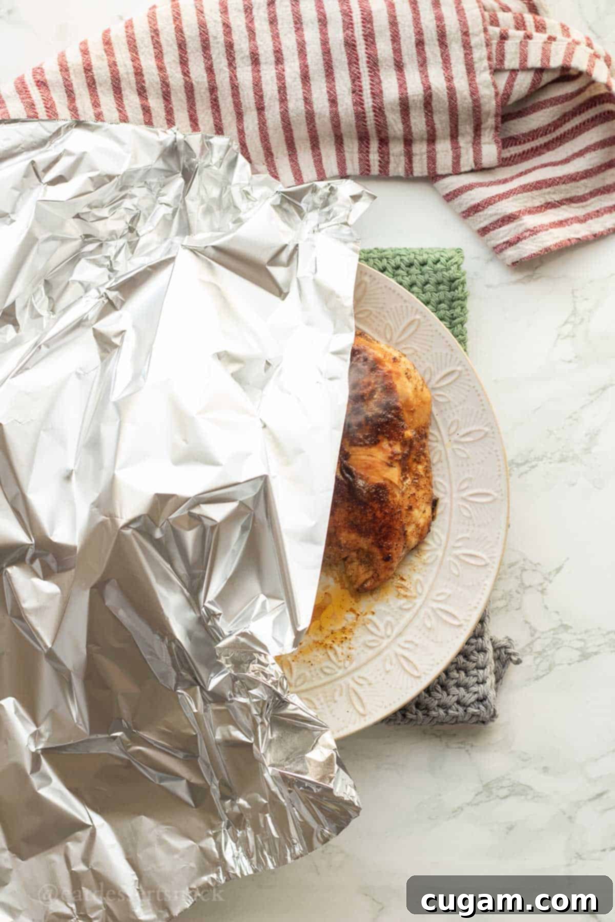 DIY Chicken Taco Spice Mix 7 Foil covering plate of cooked mexican chicken.
