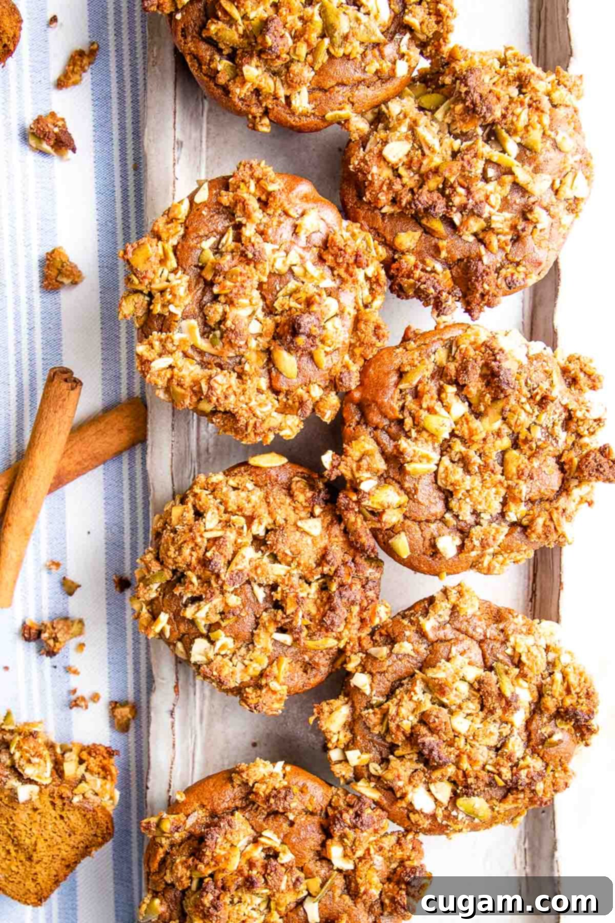 Tray of pumpkin muffins with streusel topping.
