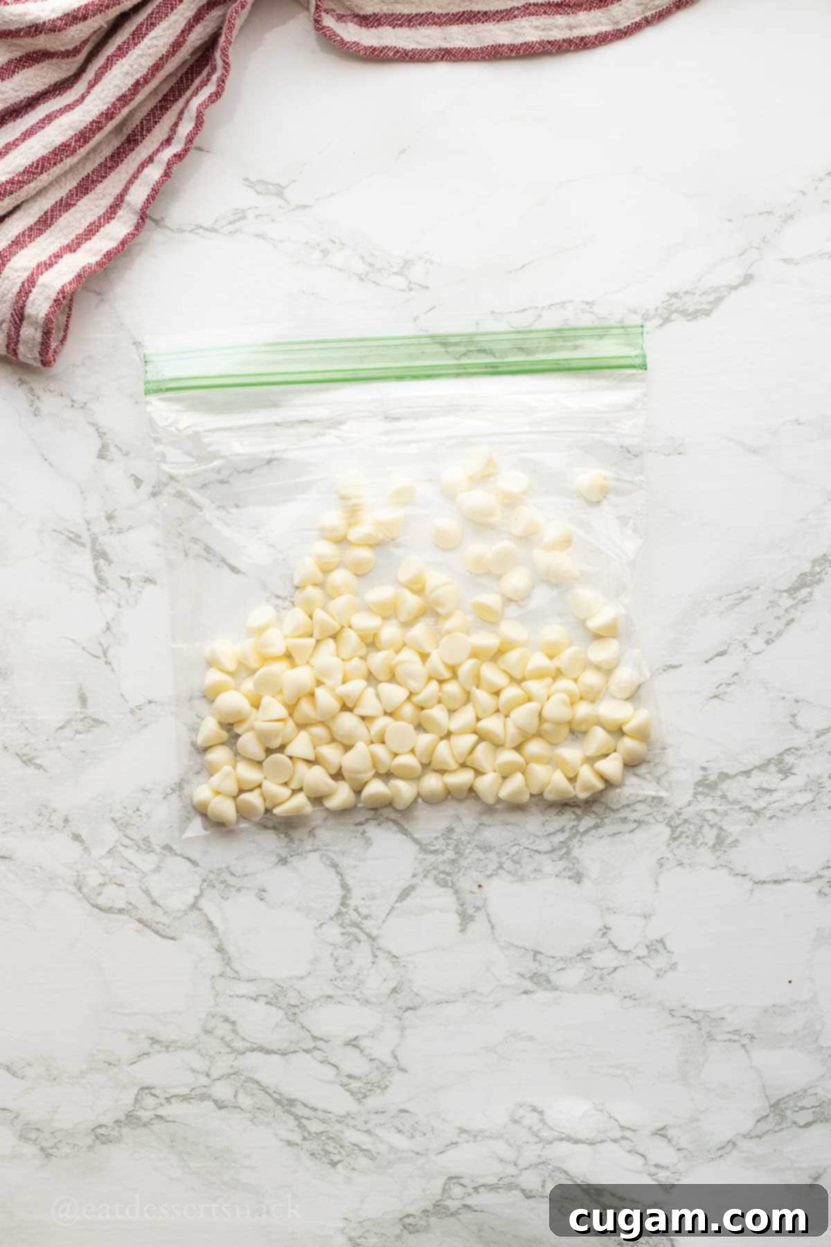White chocolate chips inside a clear zip-close bag, ready for melting.
