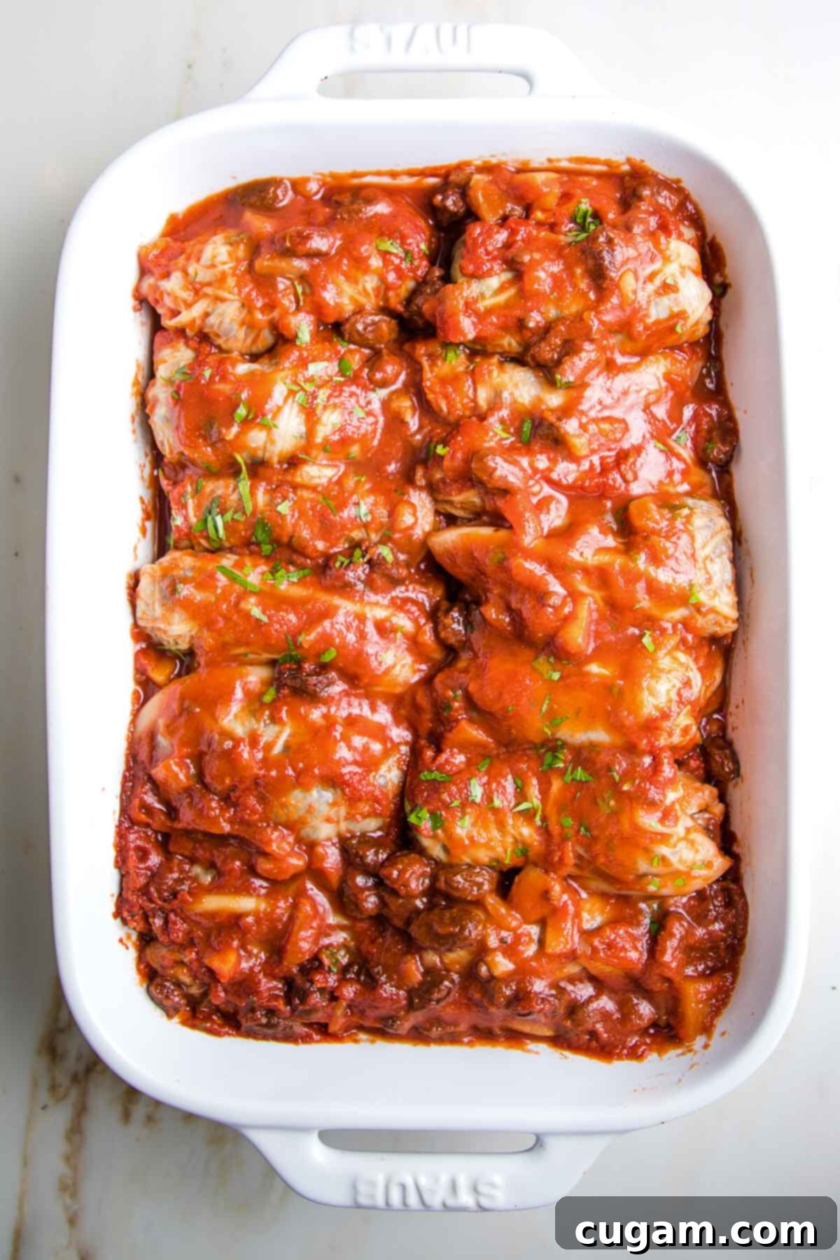 Hearty Vegan Cabbage Bundles 14 Stuffed cabbage rolls, covered in sweet and sour sauce and baked until tender.