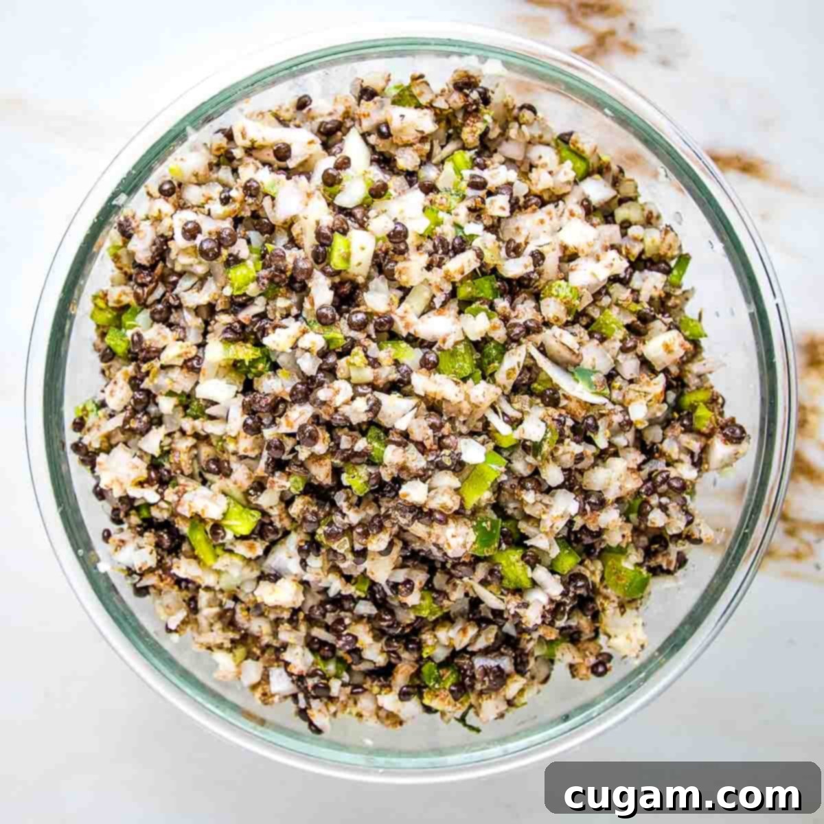 Hearty Vegan Cabbage Bundles 9 Plant-based stuffed cabbage mixture with lentils, onions, green peppers.