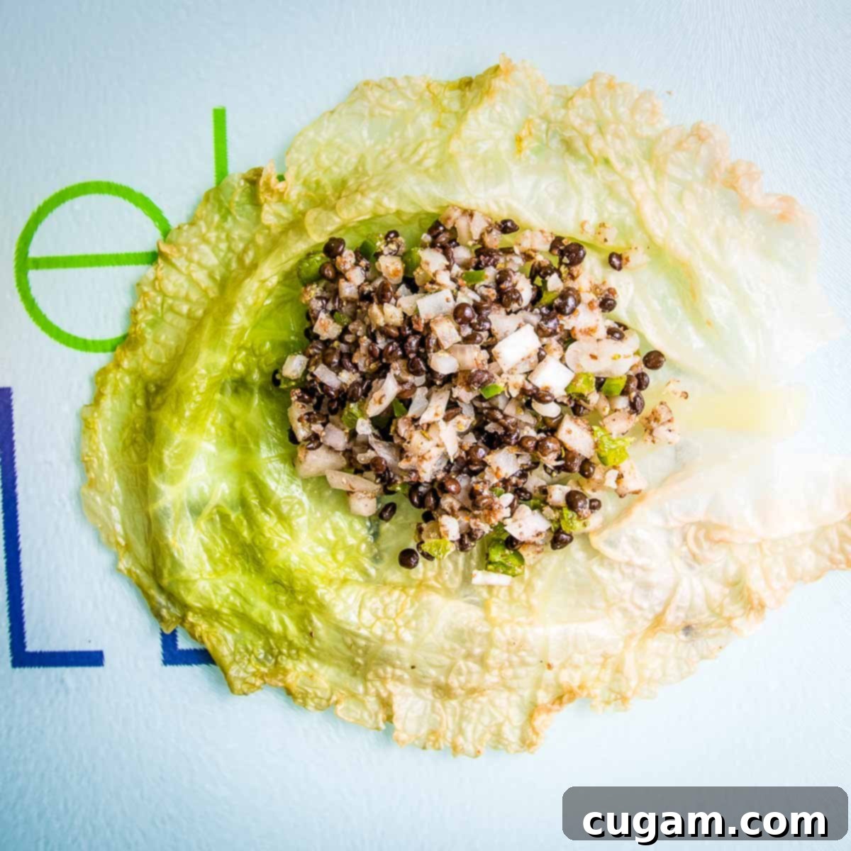 Hearty Vegan Cabbage Bundles 10 Vegan filling on top of a wilted piece of cabbage.