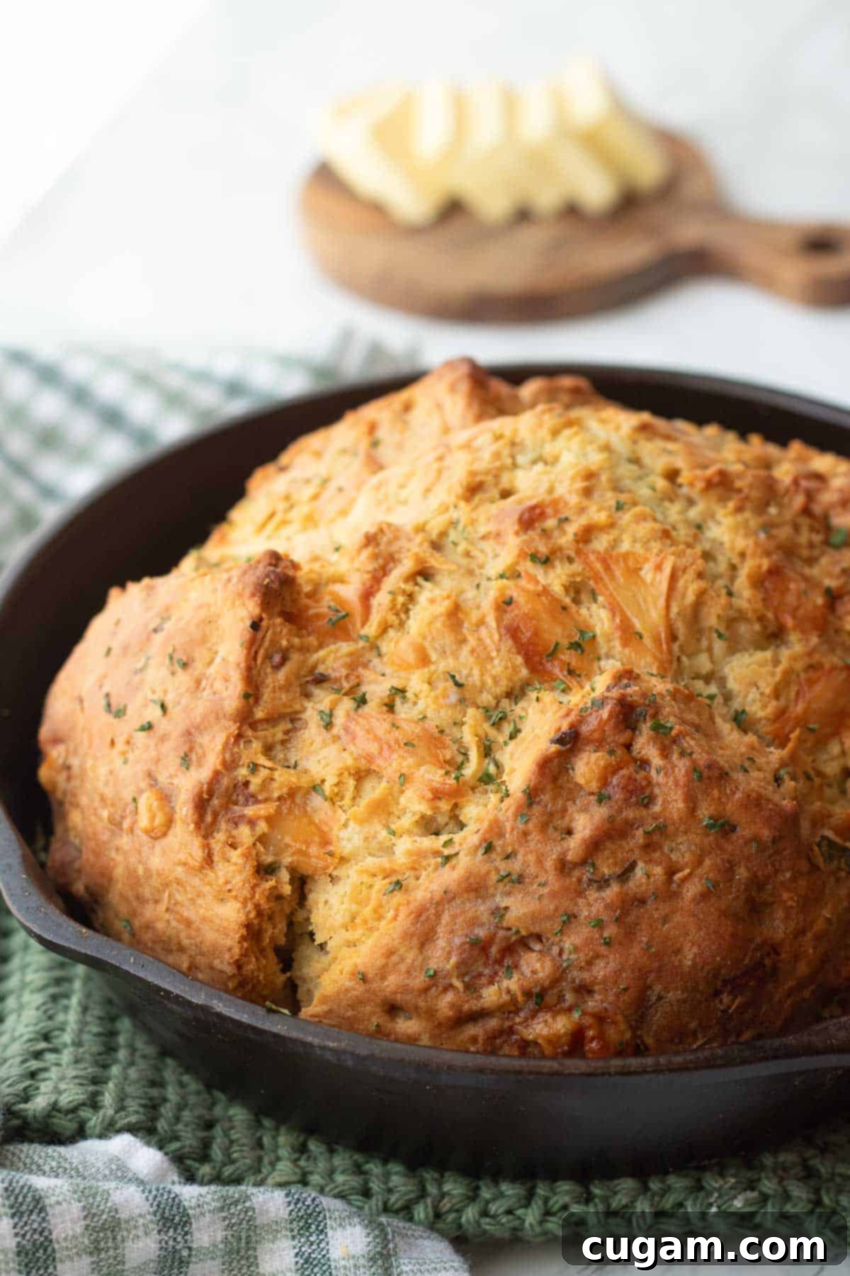 Baked cheese Irish soda bread in cast iron pan.