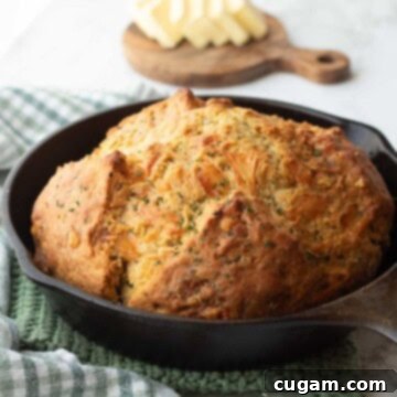 Baked cheese Irish soda bread in cast iron pan.