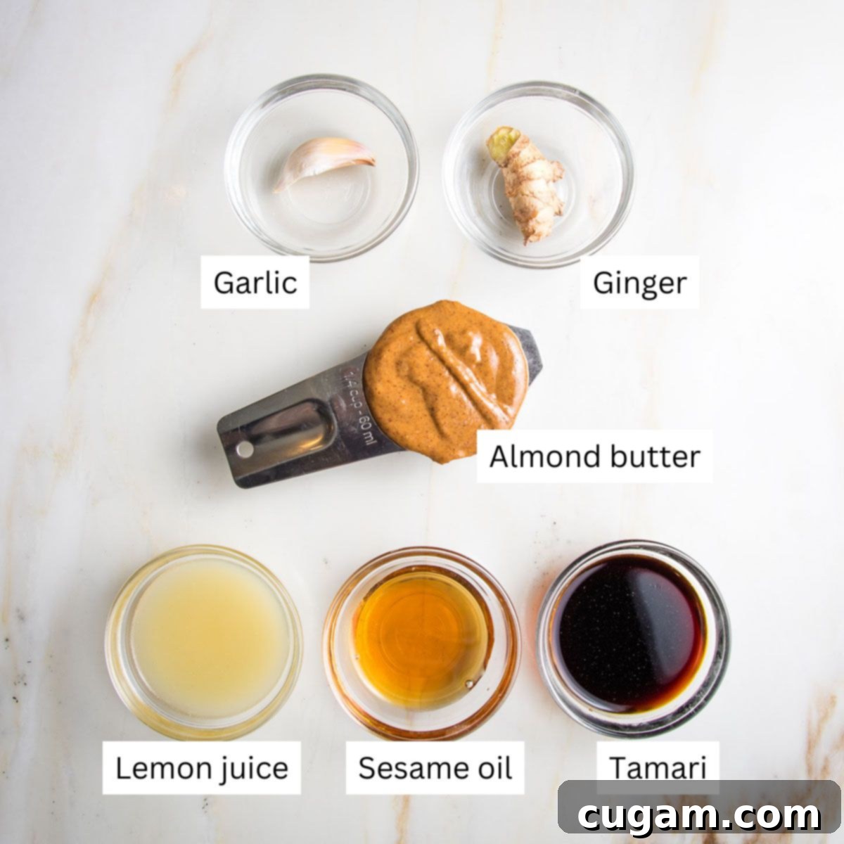 Ingredients for almond butter sauce, including grated ginger and garlic.