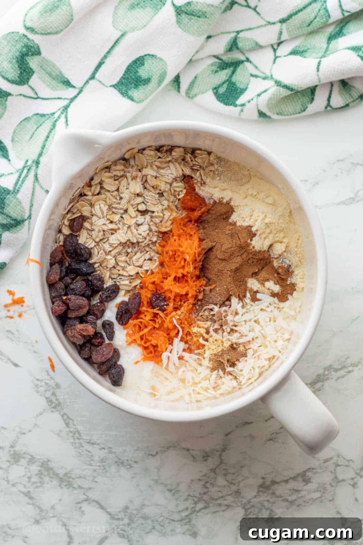 Ingredients for overnight oats in white bowl.